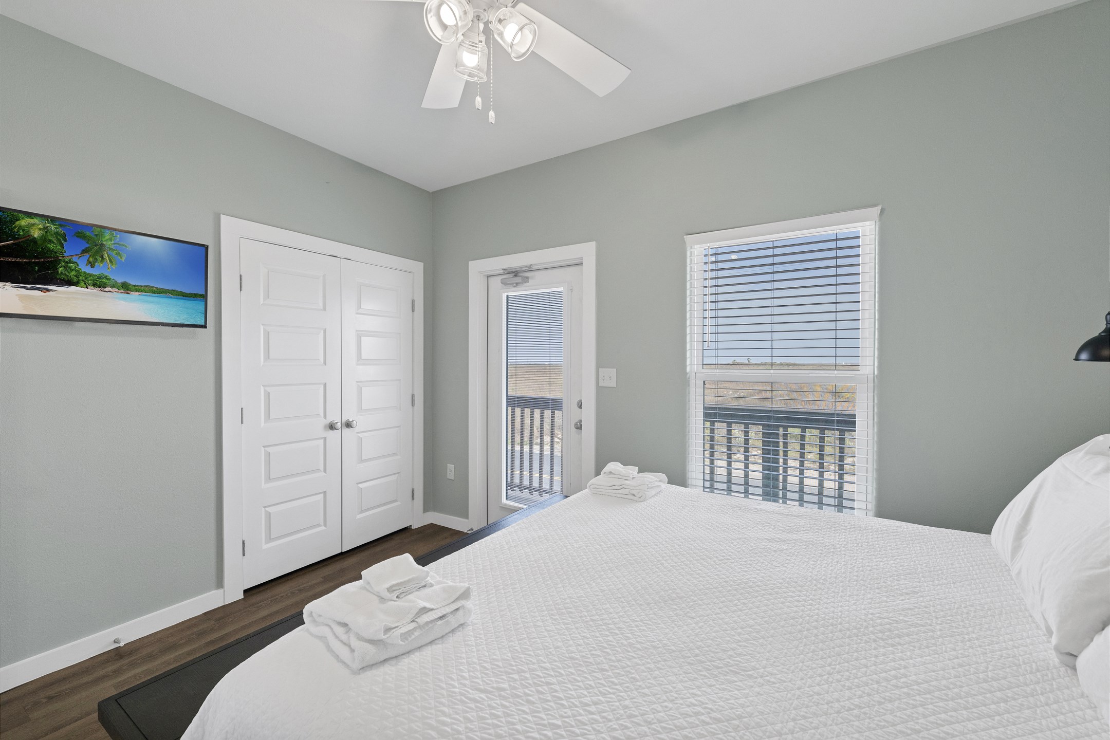 Second bedroom on the second floor with king size bed, private balcony and flat screen TV