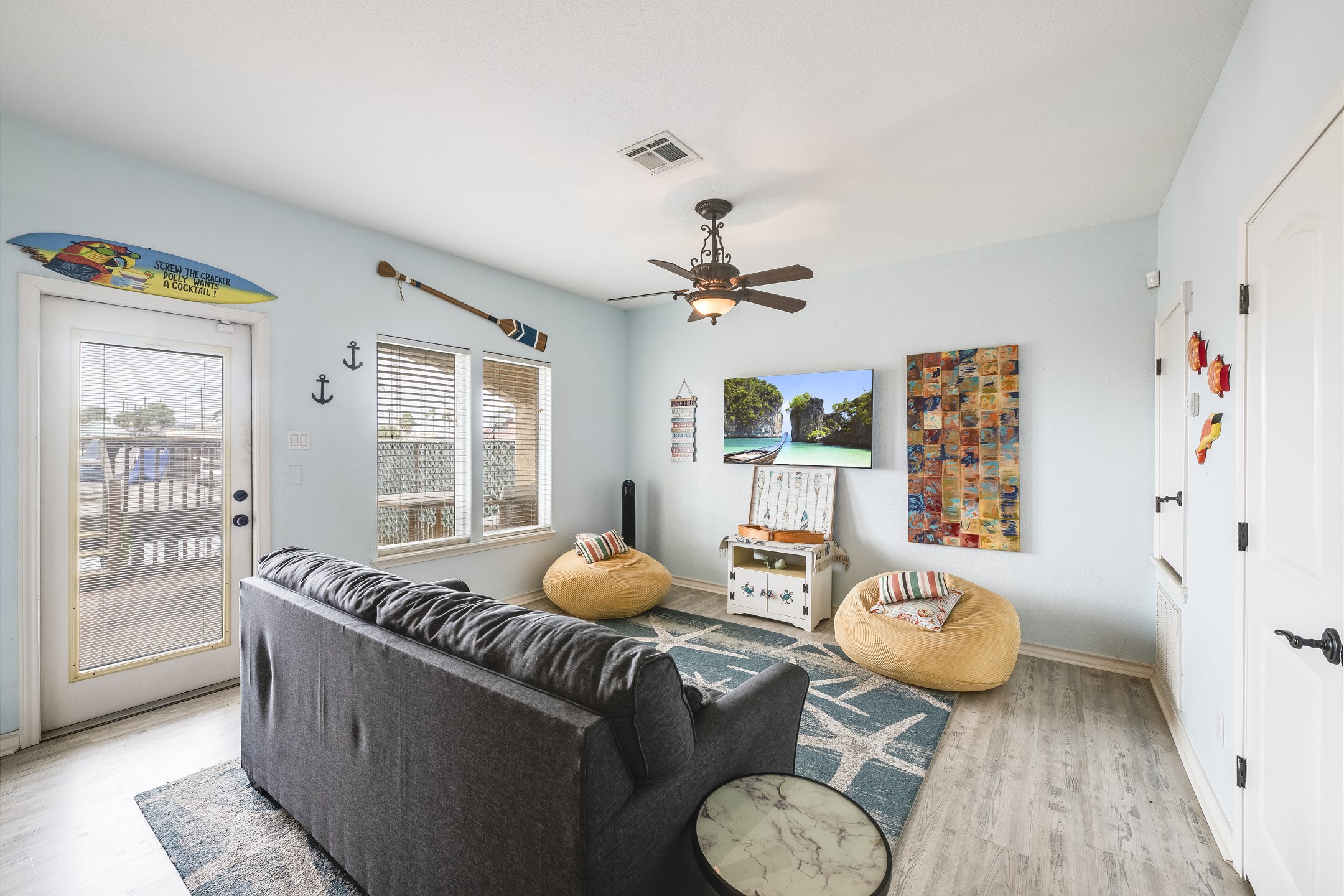 Cozy mother-in-law suite with sleeper sofa, coastal decor and flat screen TV to enjoy