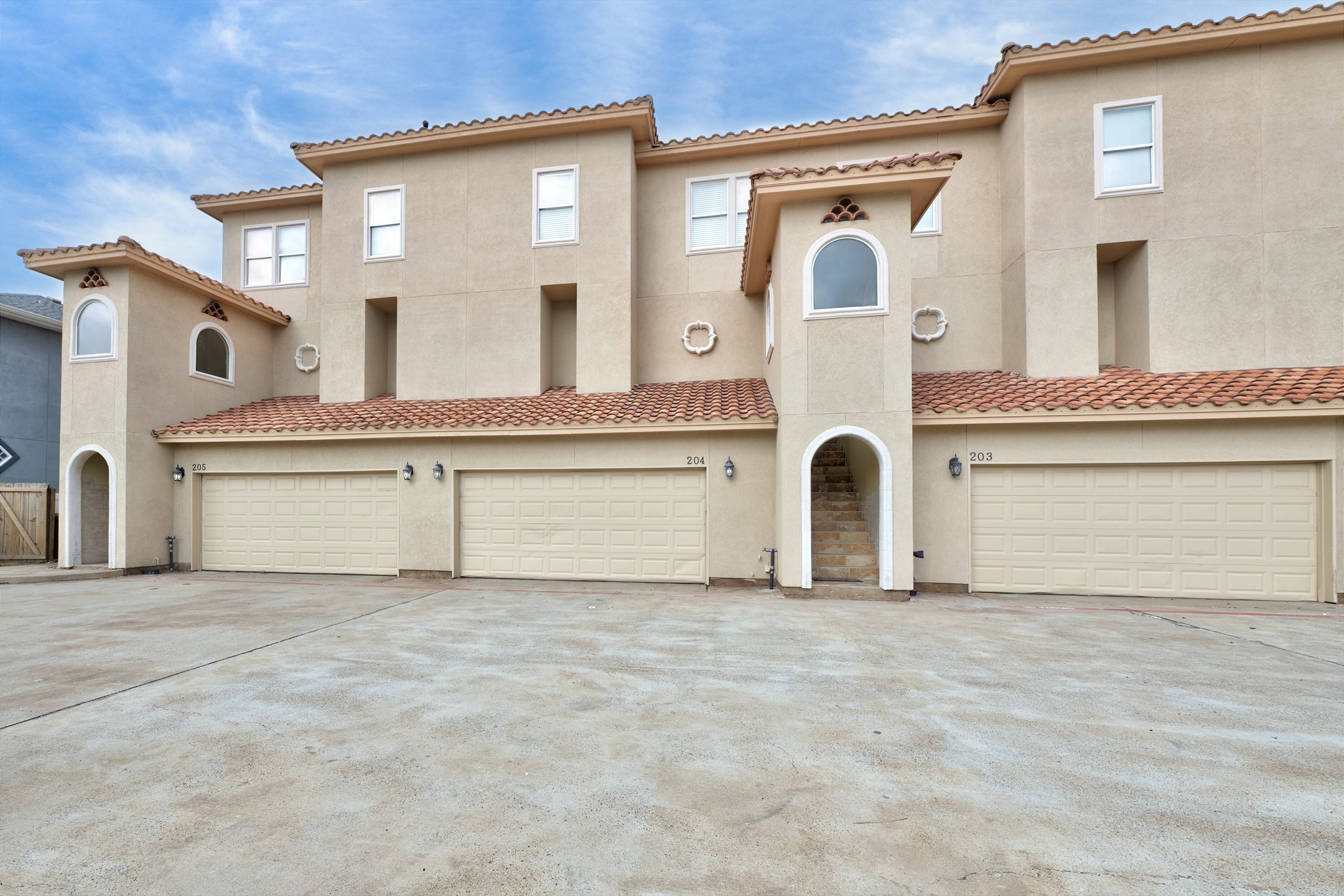 Front entrance to property on the second floor and garage access for parking