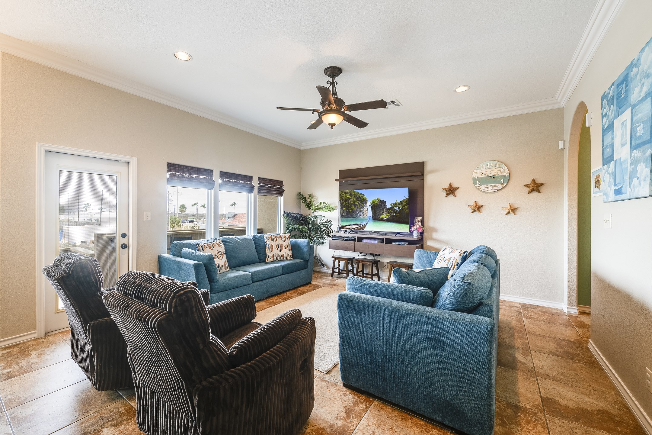 Cozy living area with plenty of seating around the flat screen TV to enjoy time with the family