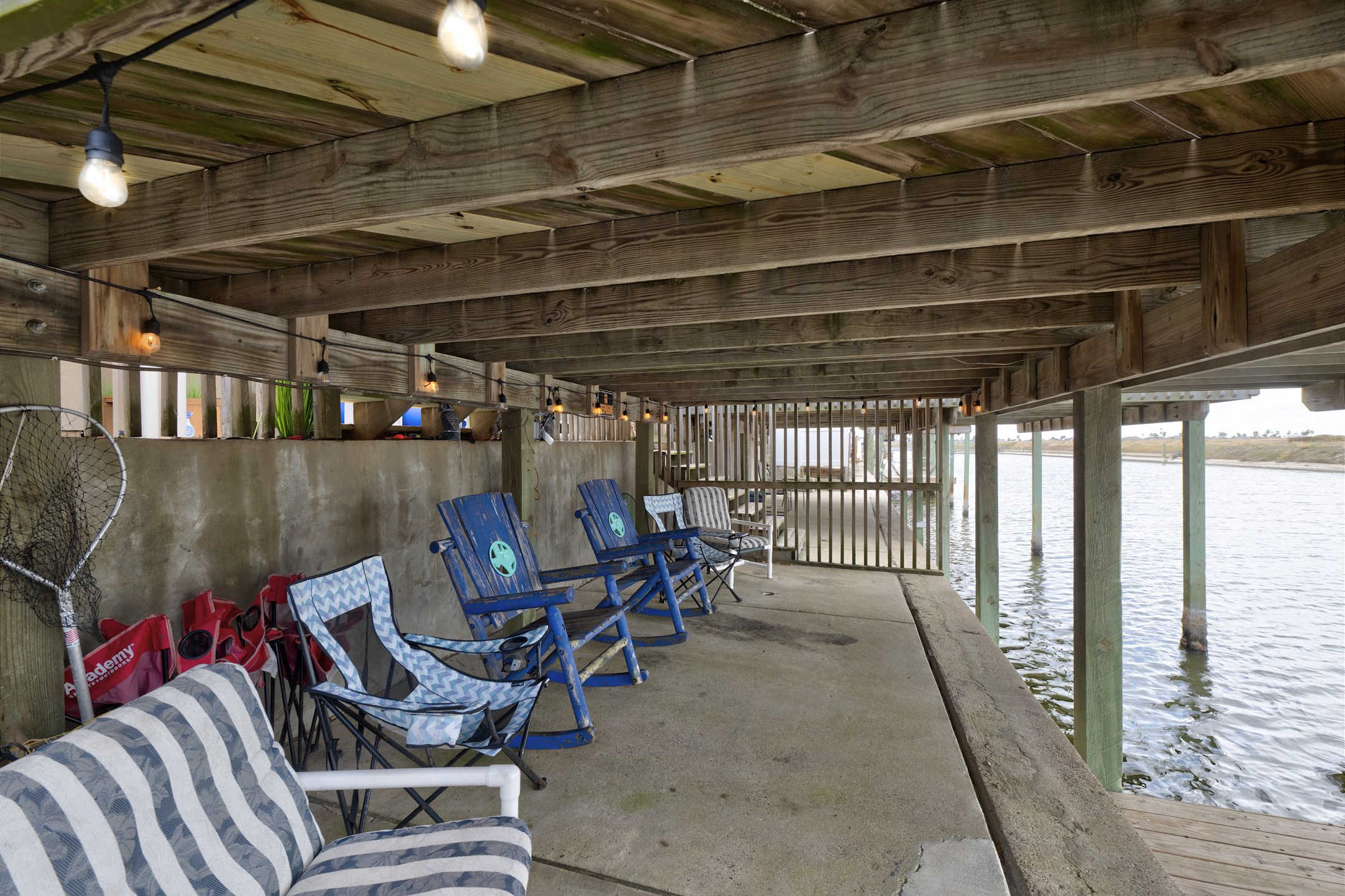 Super cool lower deck with seating to relax, fish and enjoy the water breeze