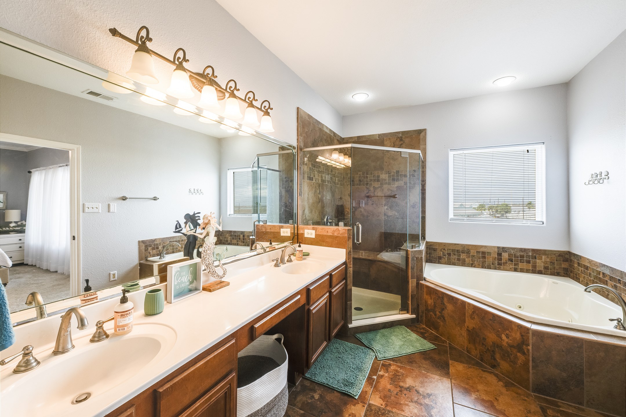 Primary bathroom with double sinks, walk-in shower and garden tub for relaxing