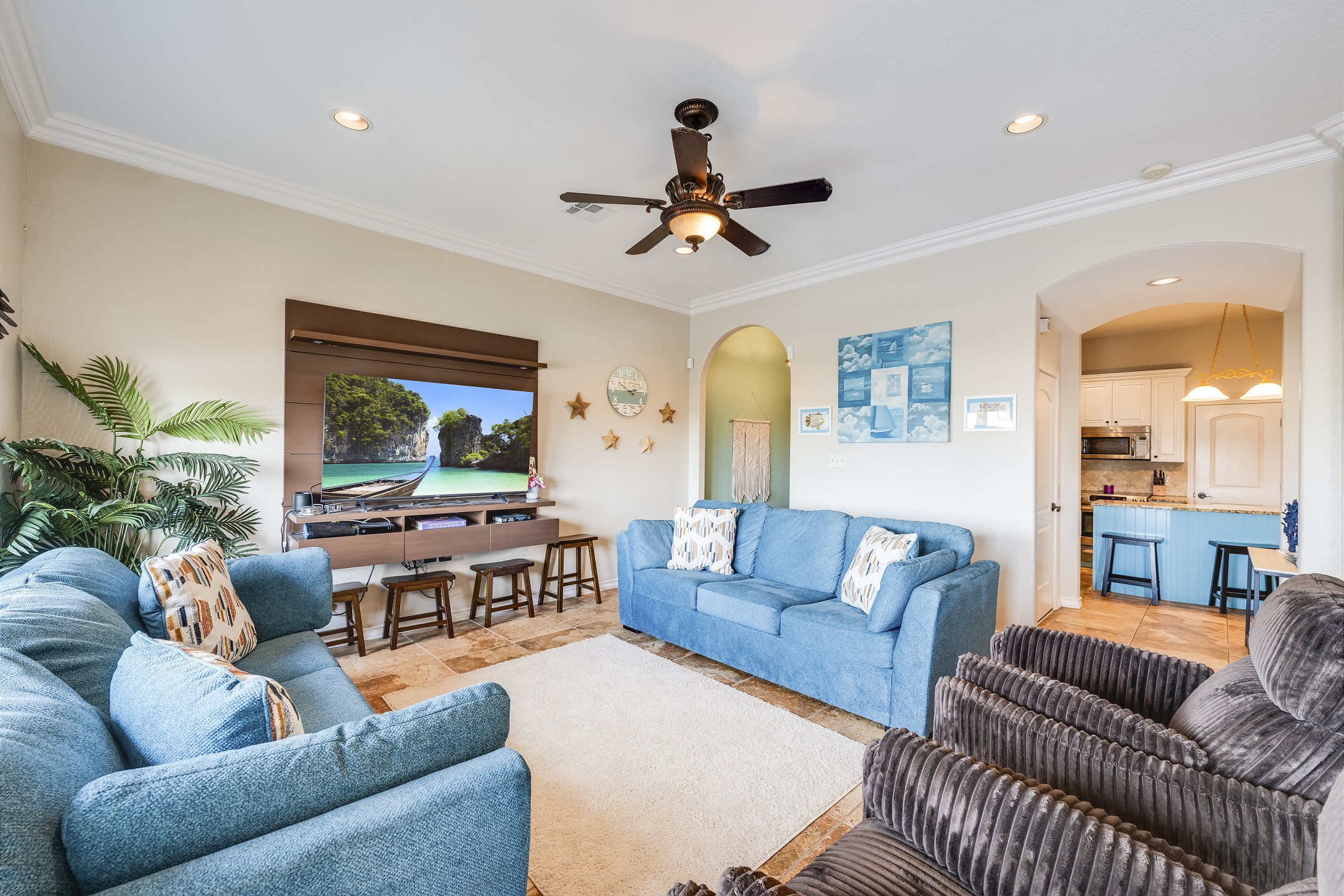 Open concept living space with bright lighting - perfect spot to have family gatherings