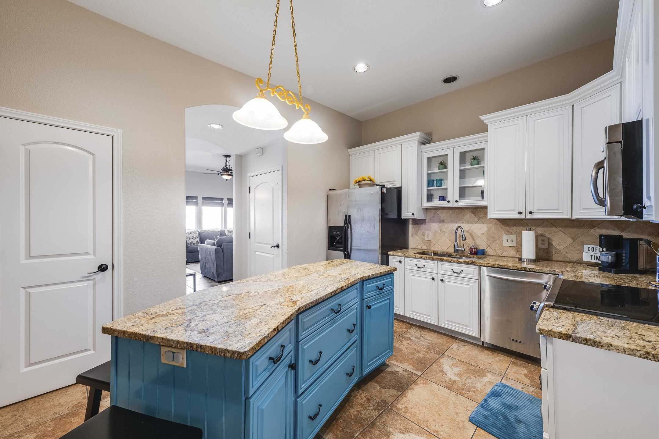 Fully equipped kitchen with stainless steel appliances and ample storage space