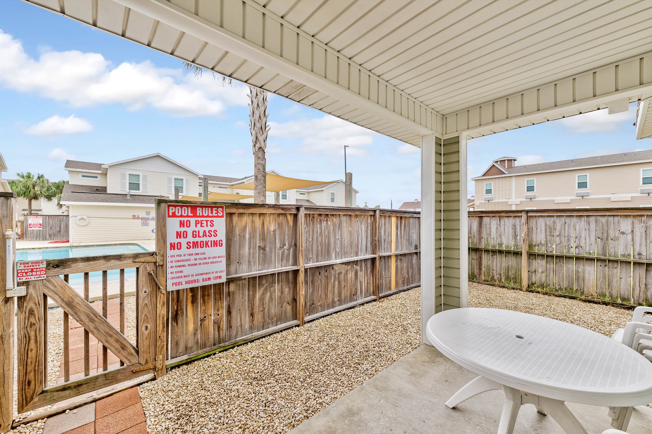 Inviting, private patio retreat with direct access to the community pool 