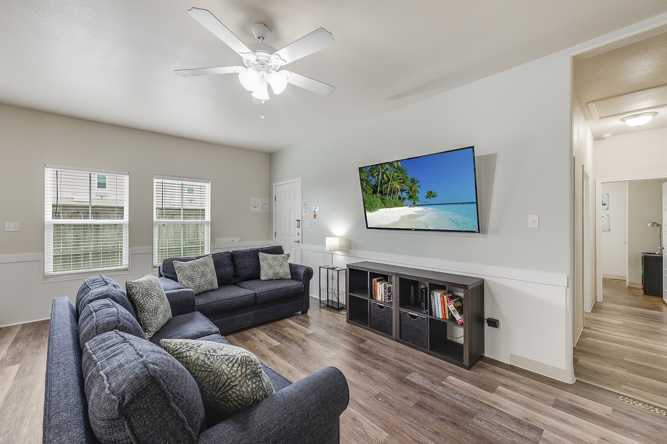 Stylish living room with modern furnishings and flat-screen TV
