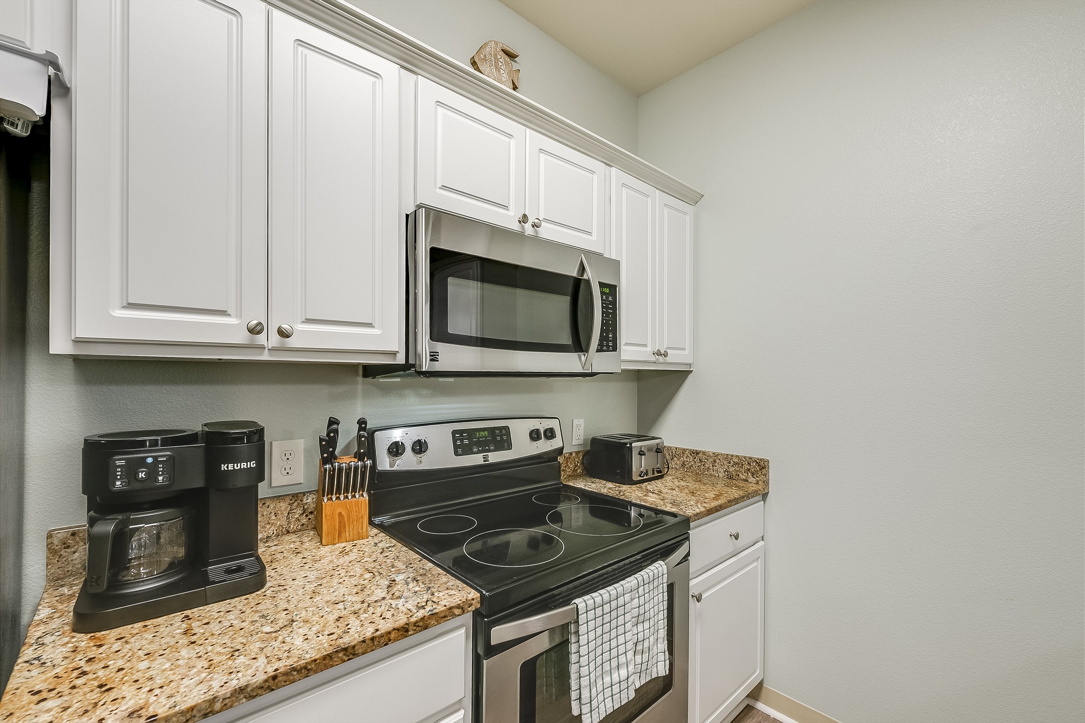 Well equipped kitchen with stainless steel appliances and Keurig duo 