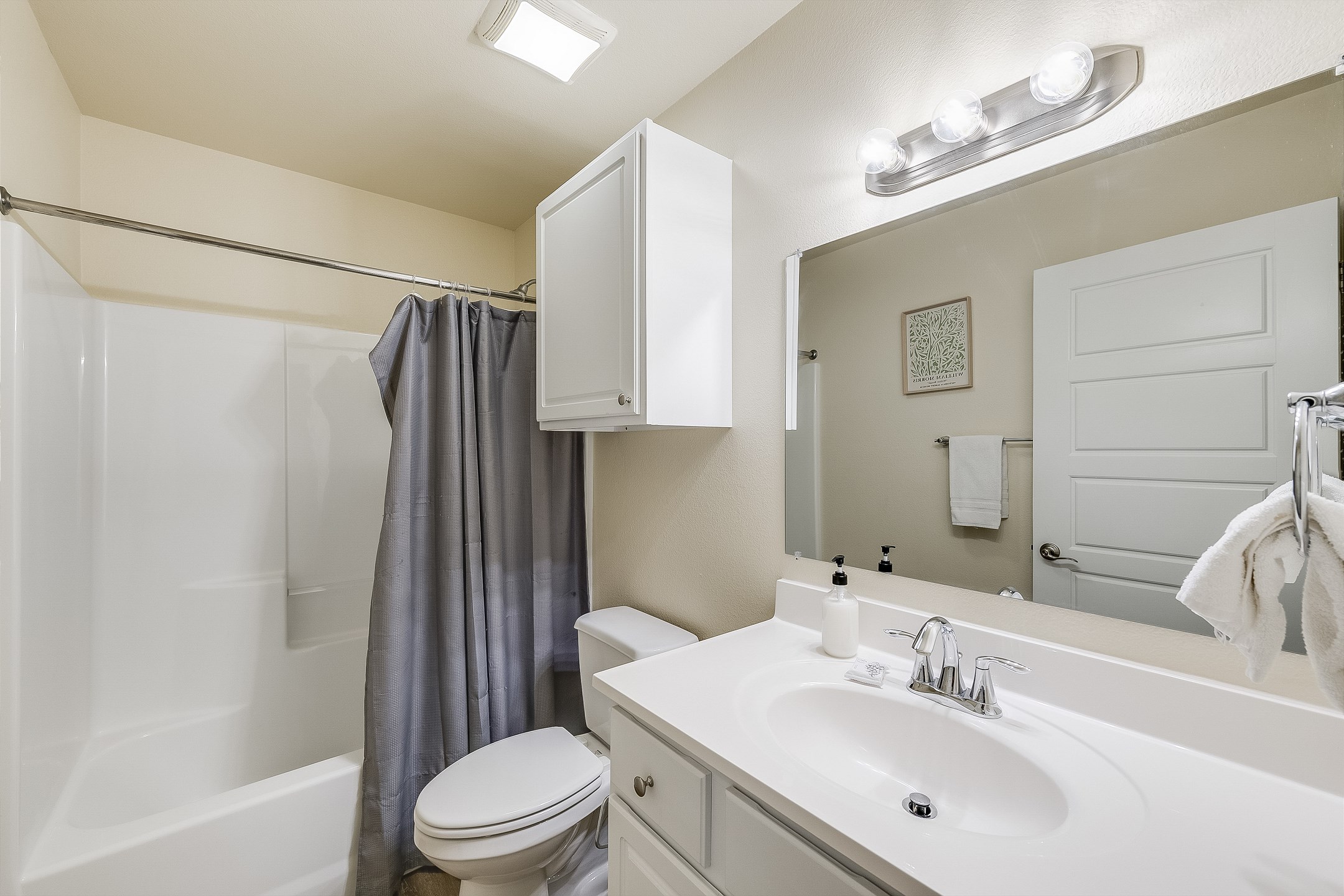 Primary bathroom on the first floor with tub/shower combo