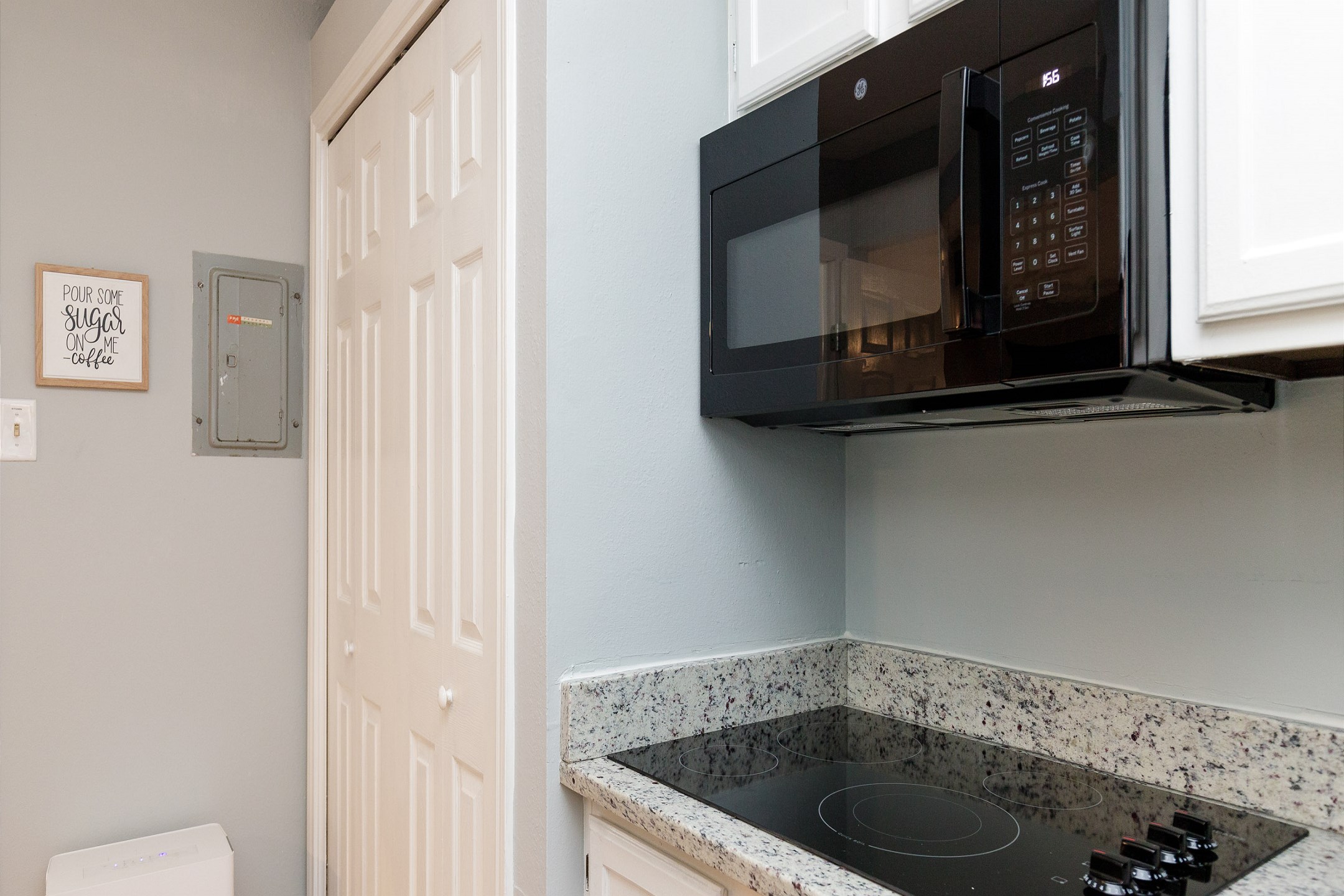 Well equipped kitchen with new appliances, counter tops and cabinets (No oven, only stove top)