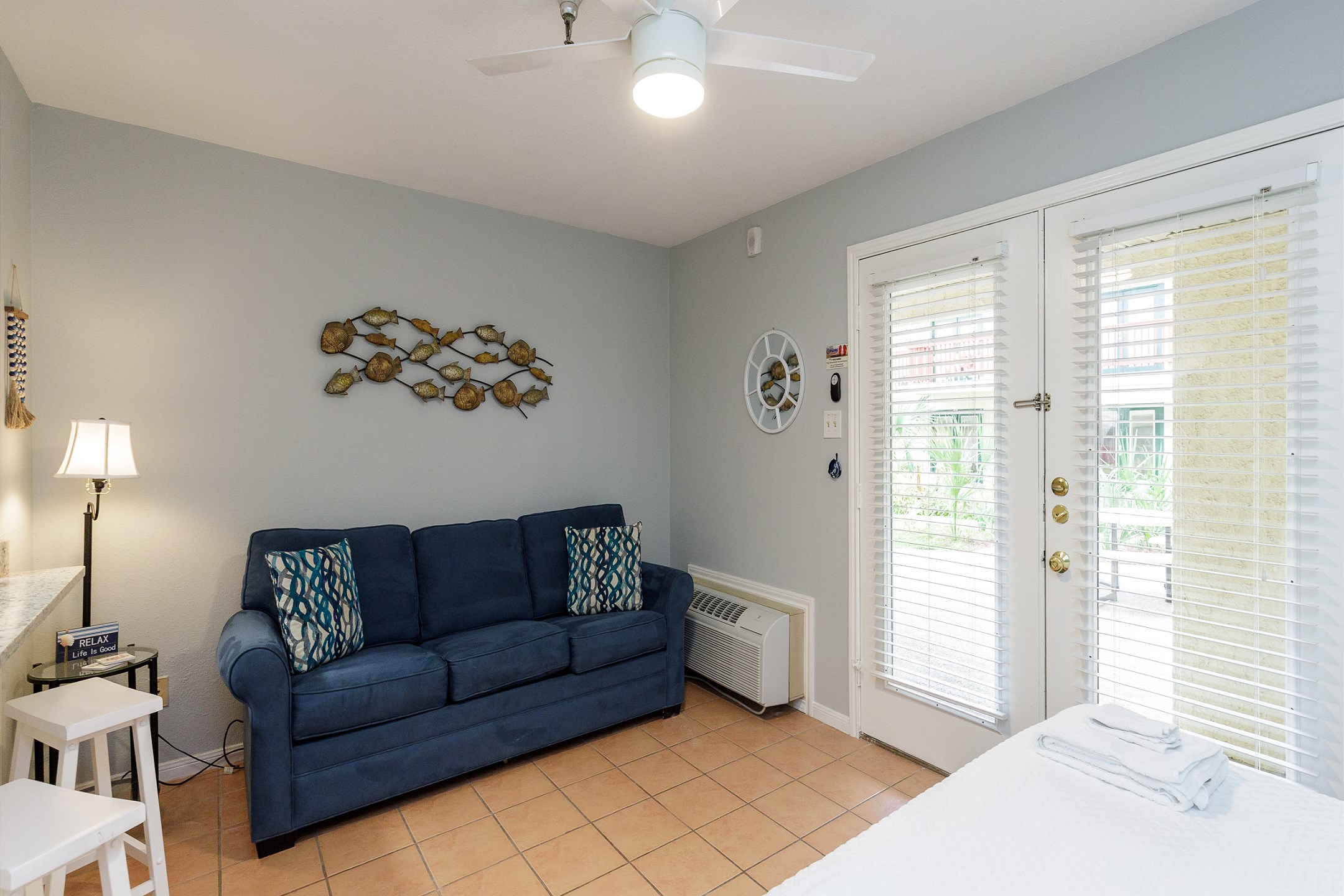 Updated living area with cozy furniture and new lighting