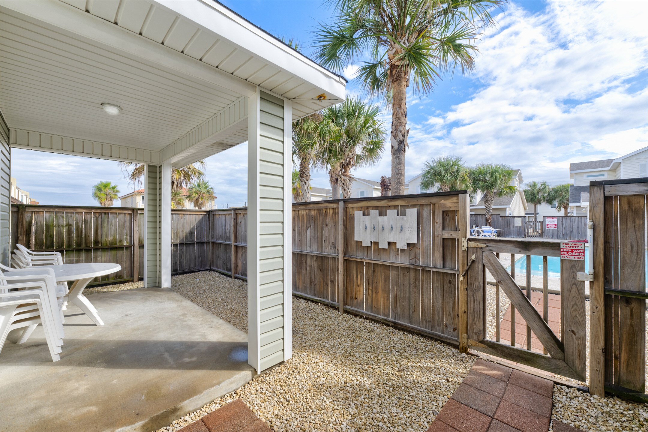 Inviting, private patio retreat with direct access to the community pool 