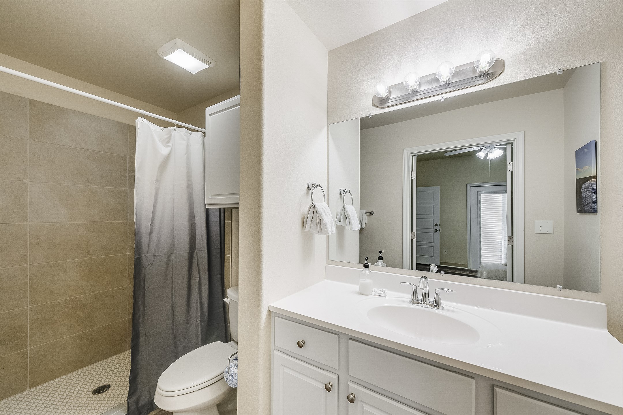 Primary bathroom on the first floor with walk in shower 