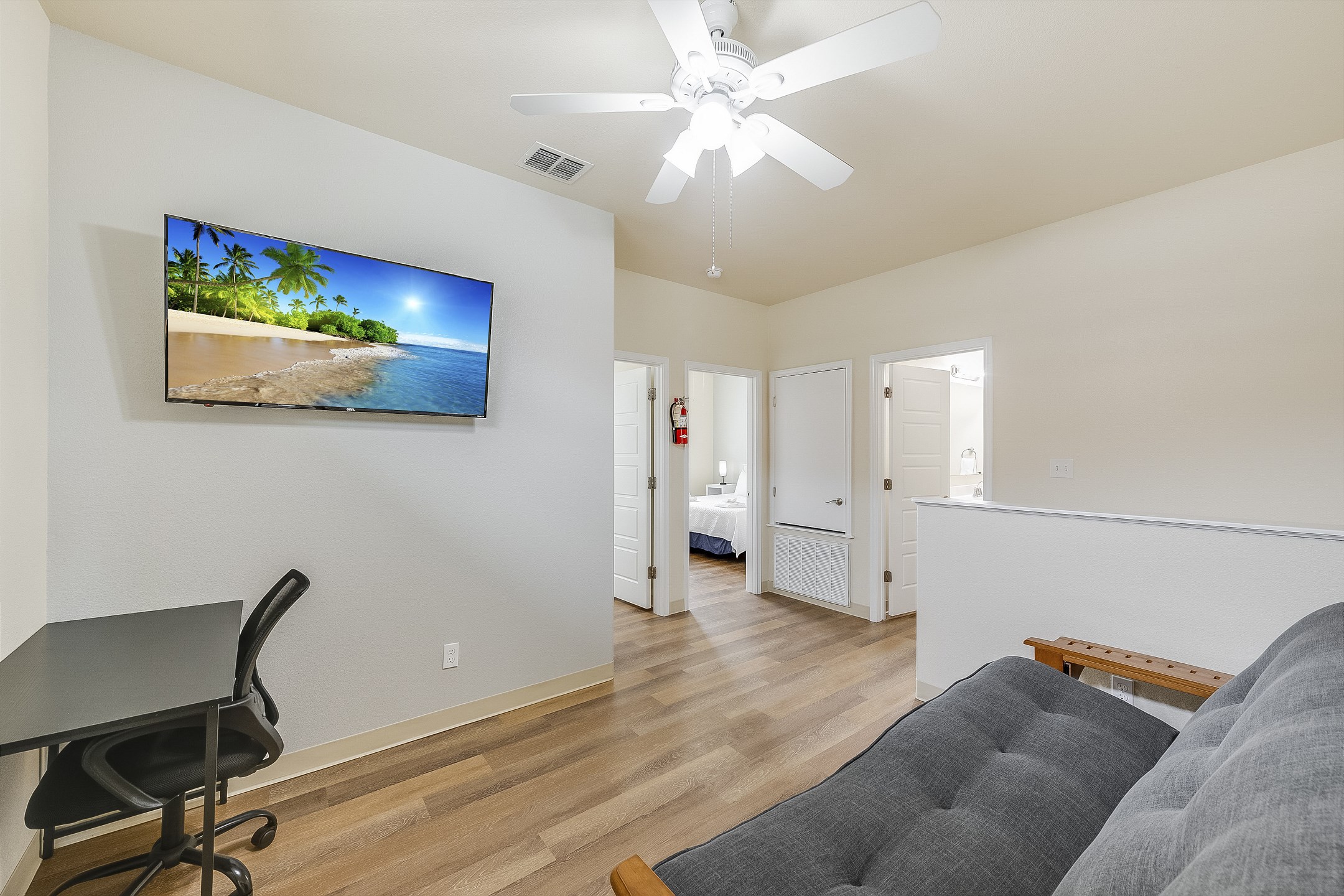 Loft area on the second floor with full size futon, work station and flat screen TV