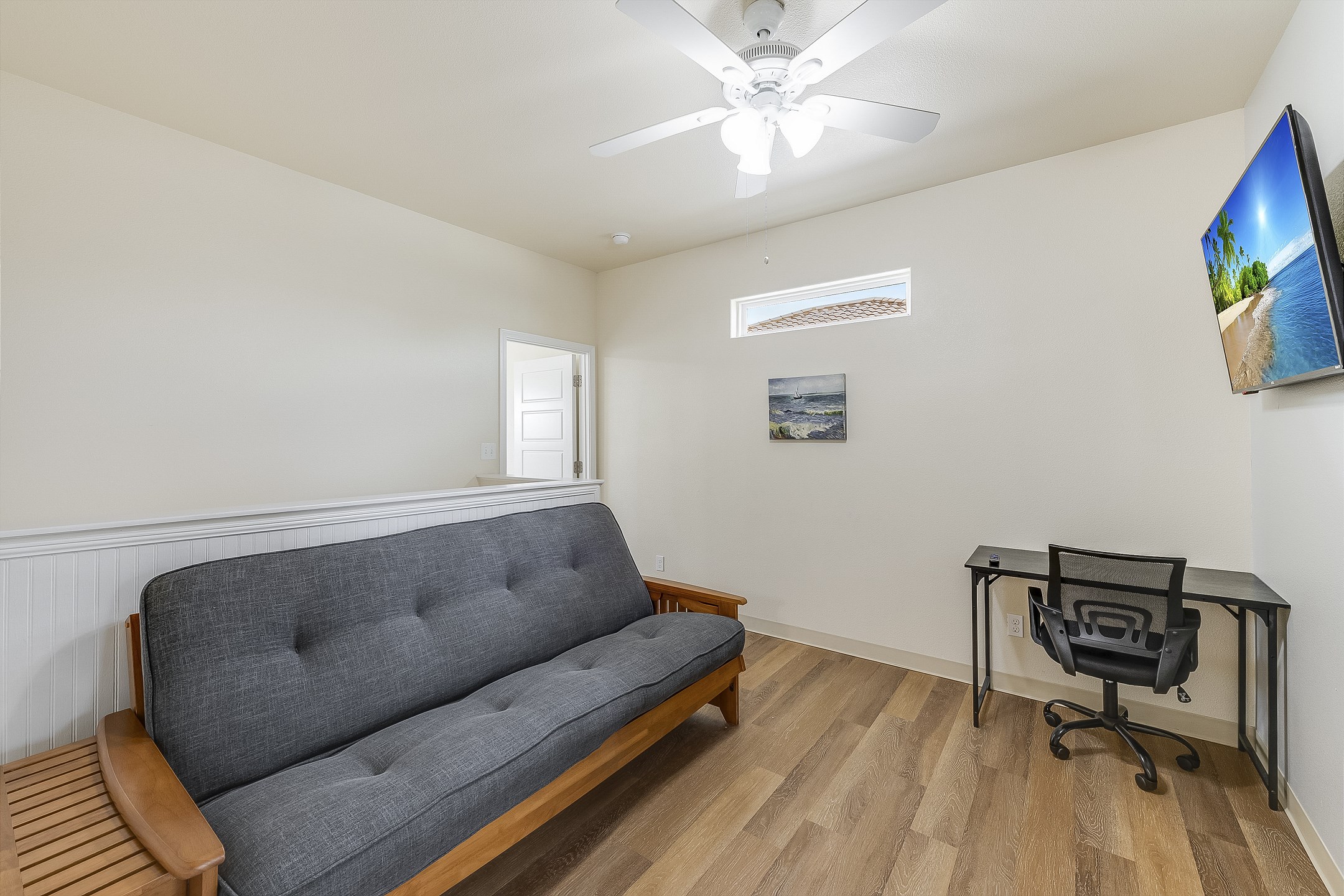 Loft area on the second floor with full size futon, work station and flat screen TV