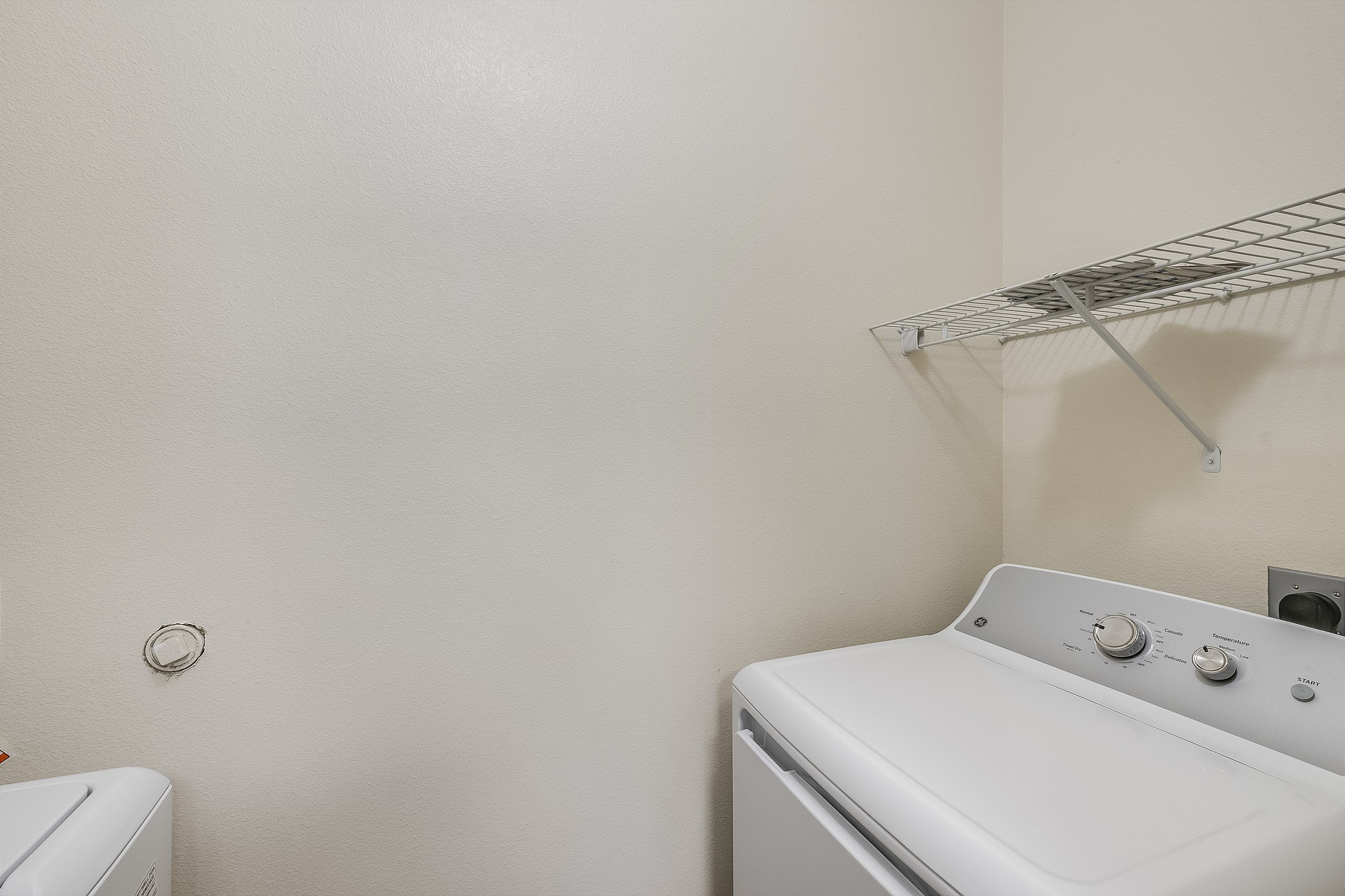 Convenient in-home laundry room with washer and dryer for guest use