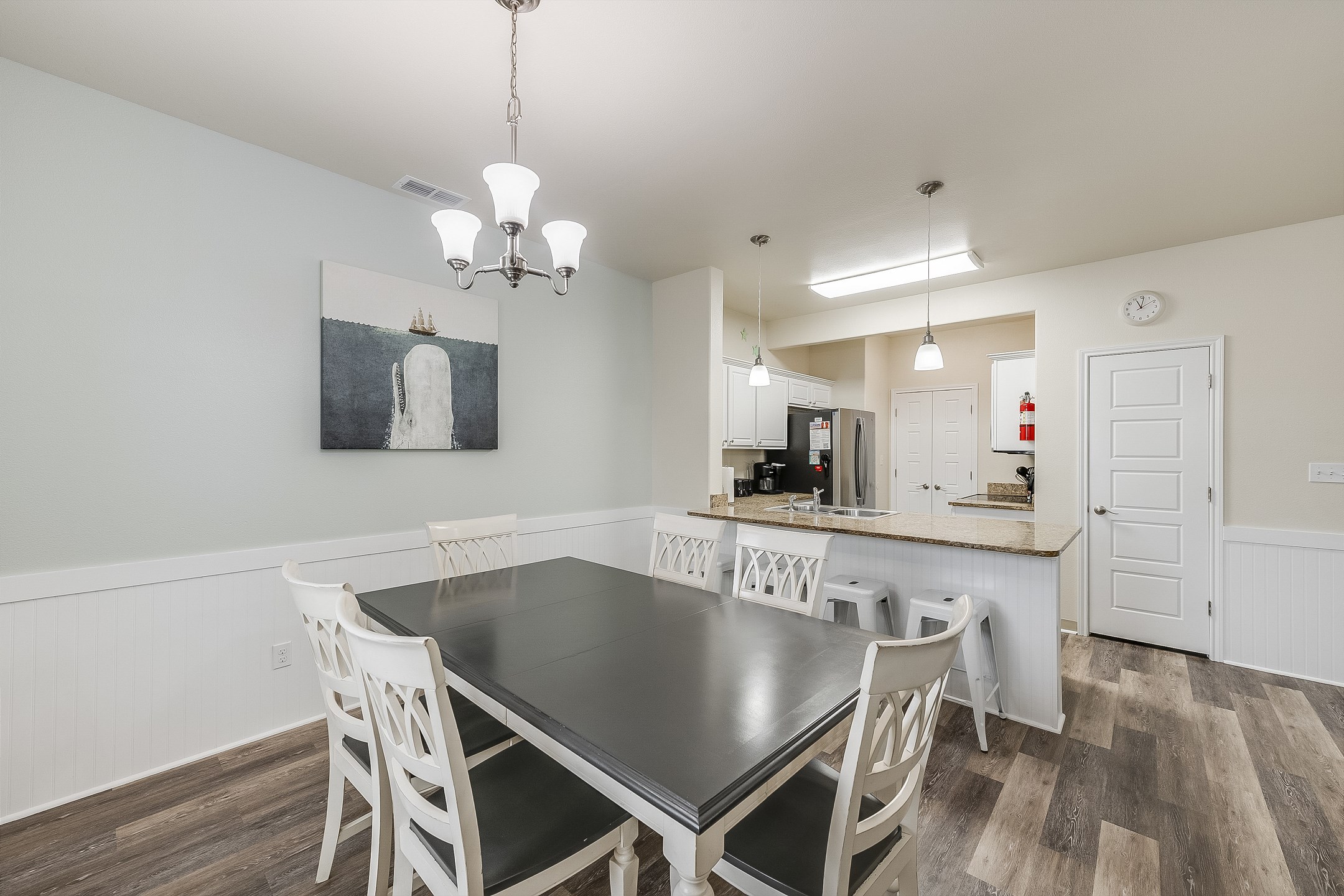 Spacious dining and kitchen areas with plenty of seating - perfect for family dinners, games, or morning coffee