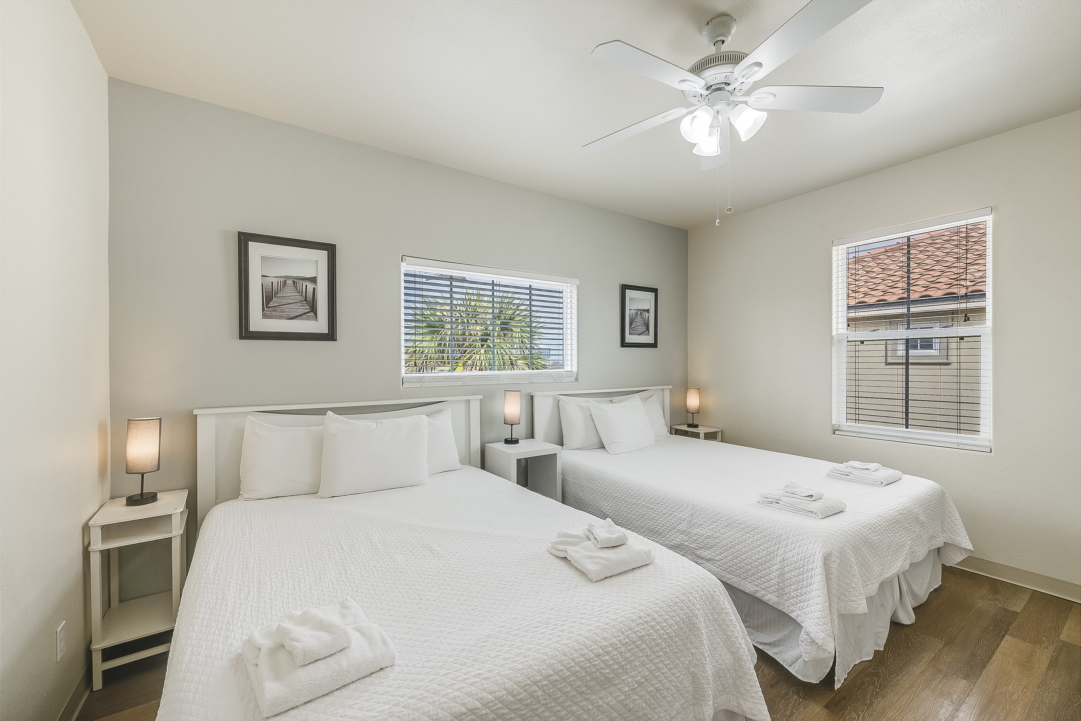 Second bedroom on the second floor with two queen size beds and private bathroom