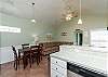 Open concept kitchen and dining area to cook meals while entertaining 