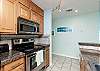 Fully equipped kitchen with ample storage 