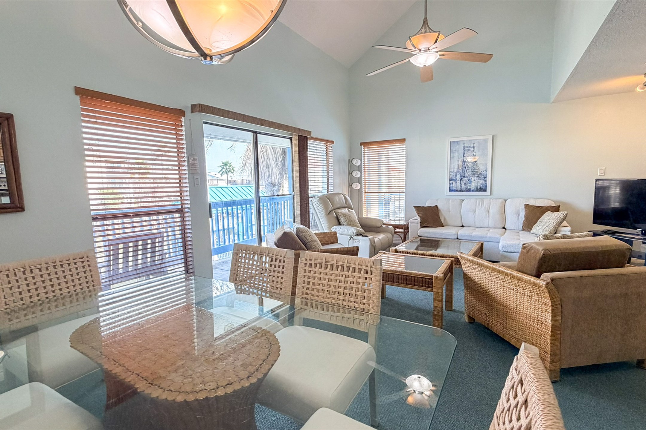 Spacious dining and living area with easy access to the water views of the canal 