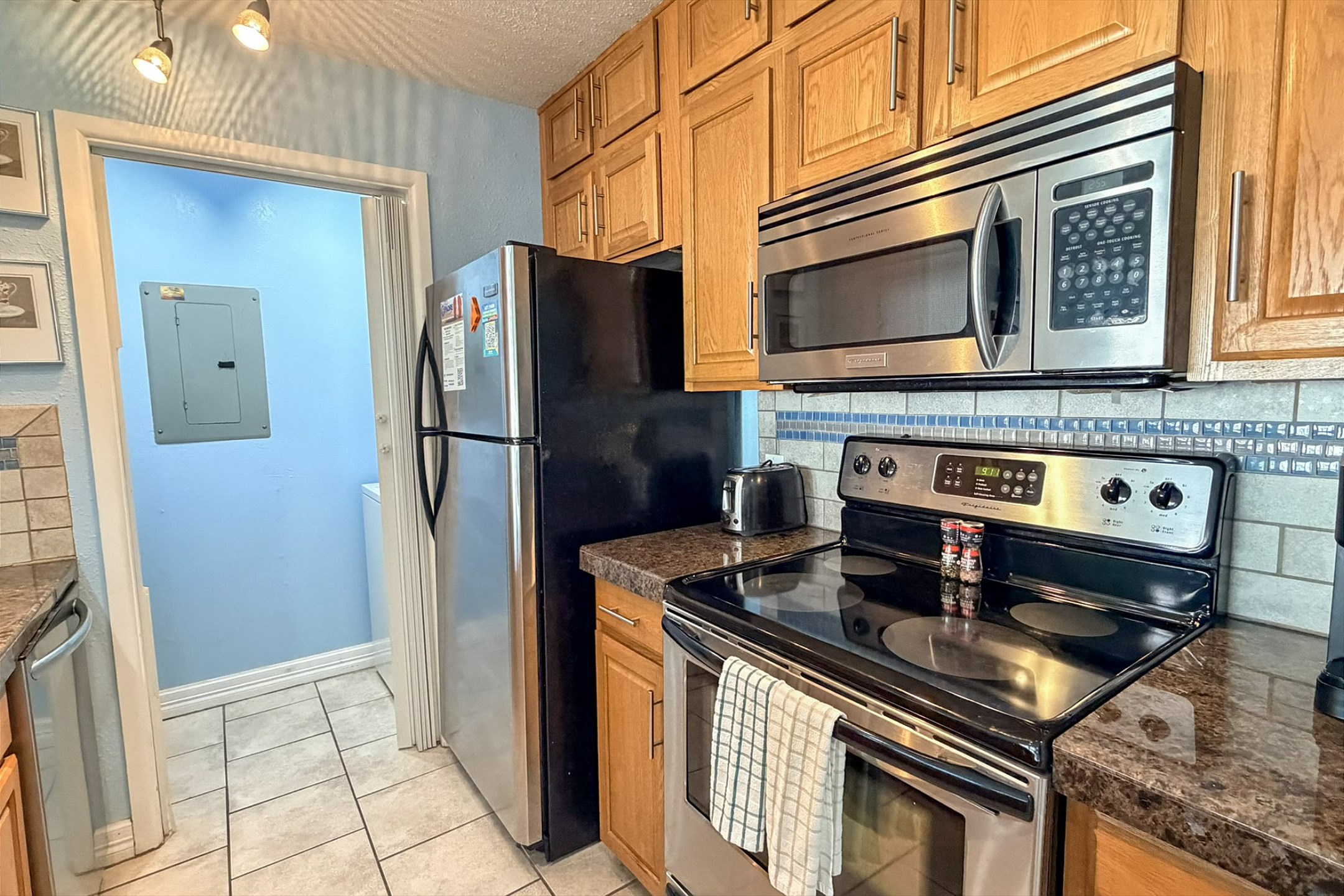 Fully equipped kitchen with stainless steel appliances and update features throughout 