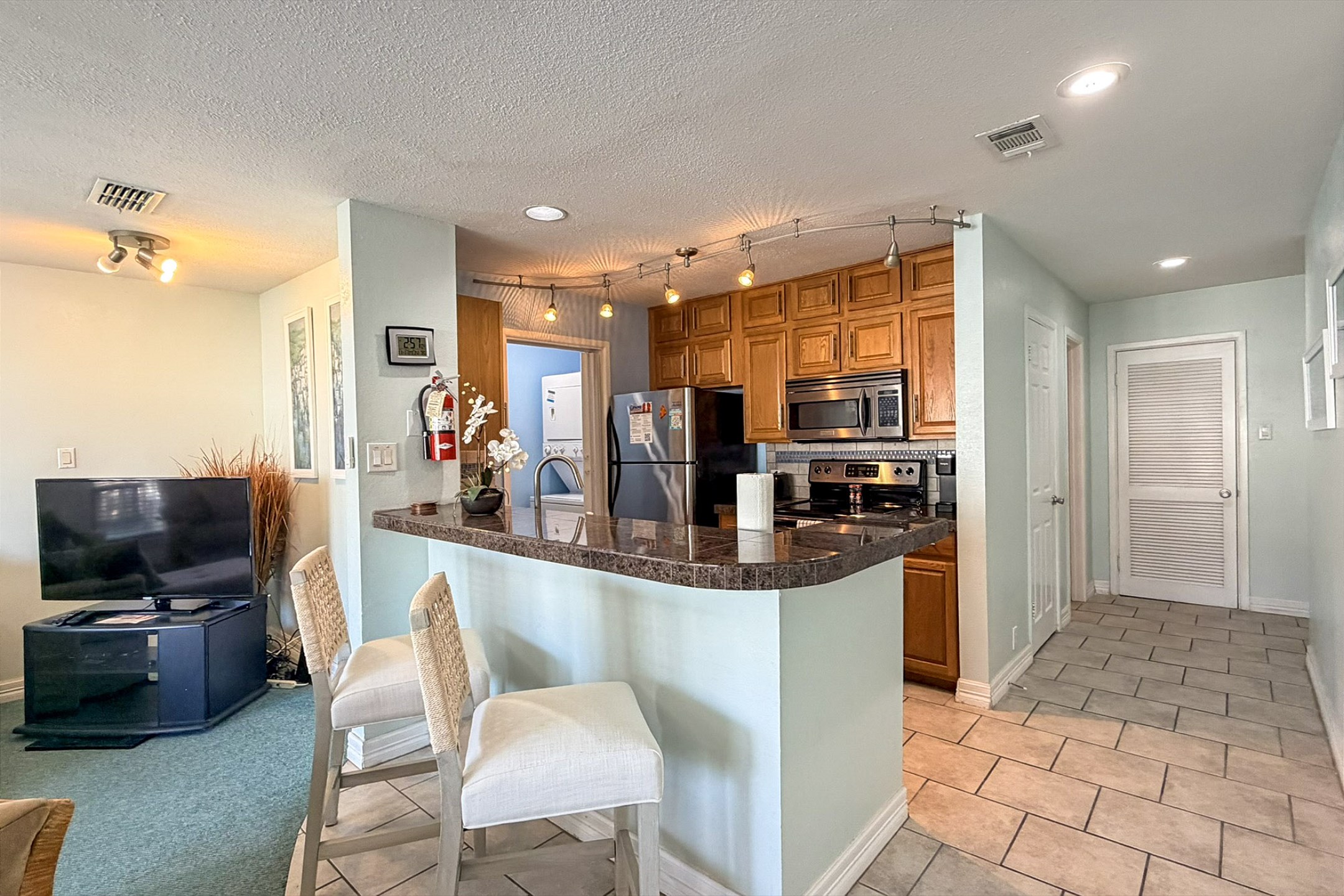 Lovely kitchen area with new barstools to enjoy the entertainment of cooking and laughter 