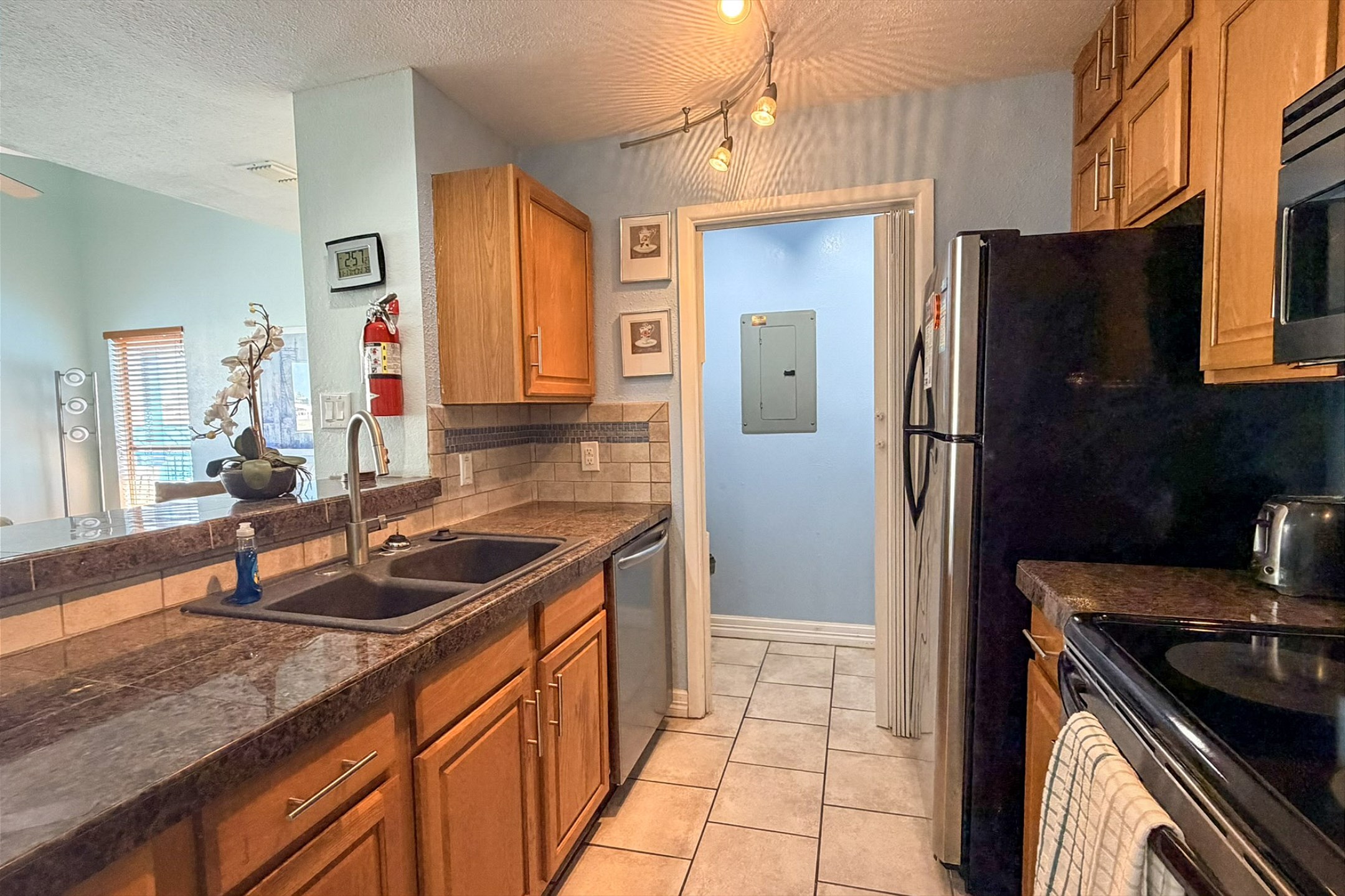 Beautiful kitchen area with plenty of counter space and 12-cup coffee maker 
