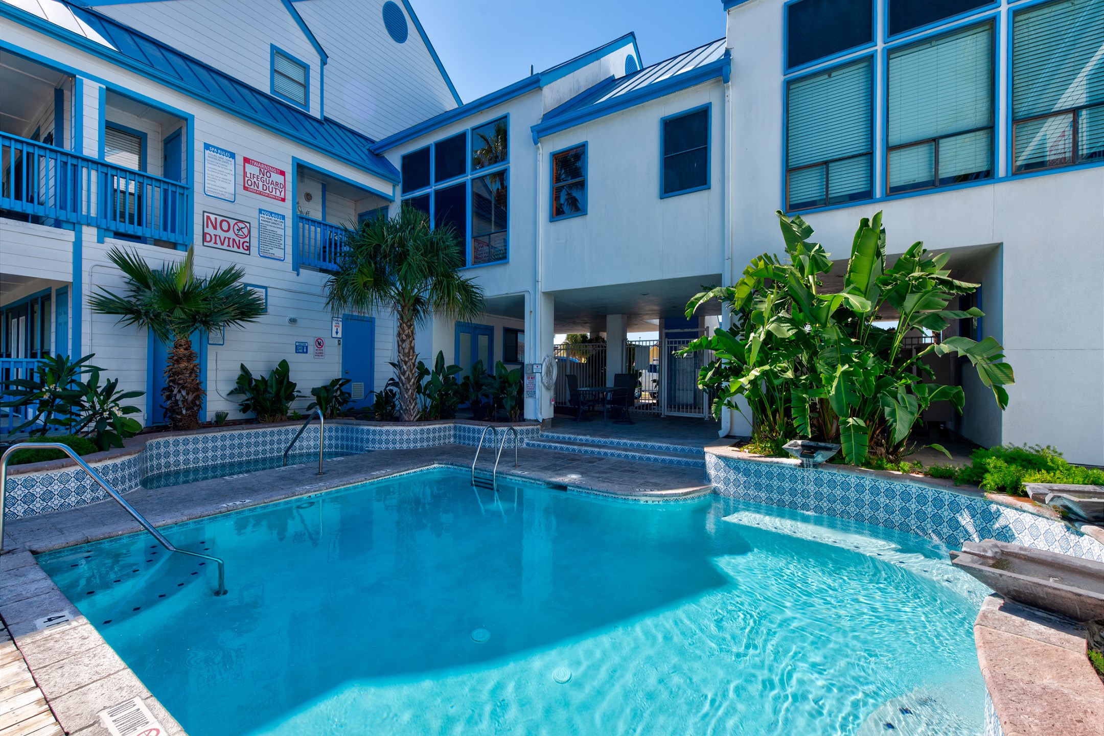 Experience endless fun at Spinnaker pool and hot tub, surrounded by tropical ambiance
