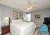 Master bedroom with king size bed and flat screen TV