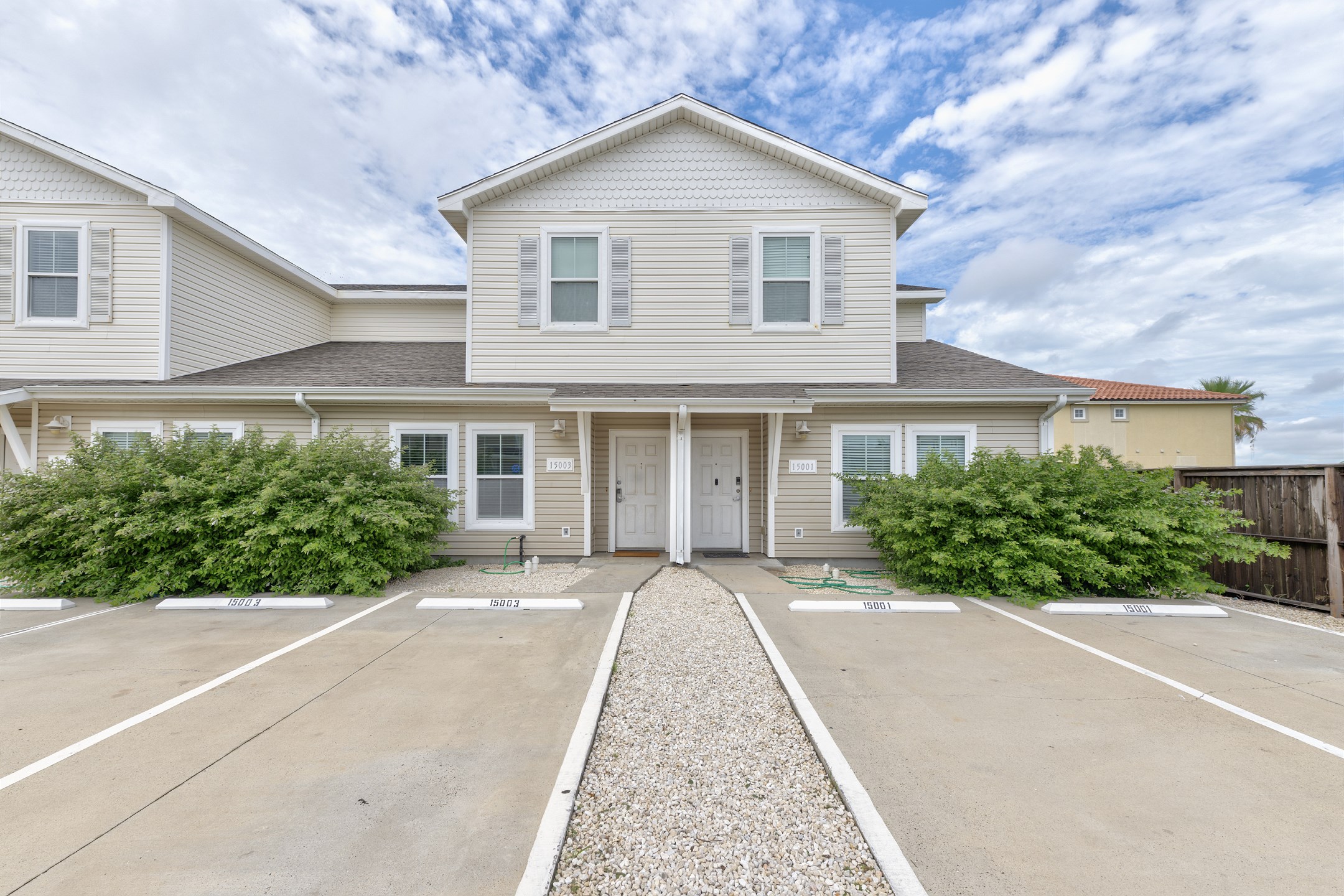 Front entrance to property with two reserved parking spaces