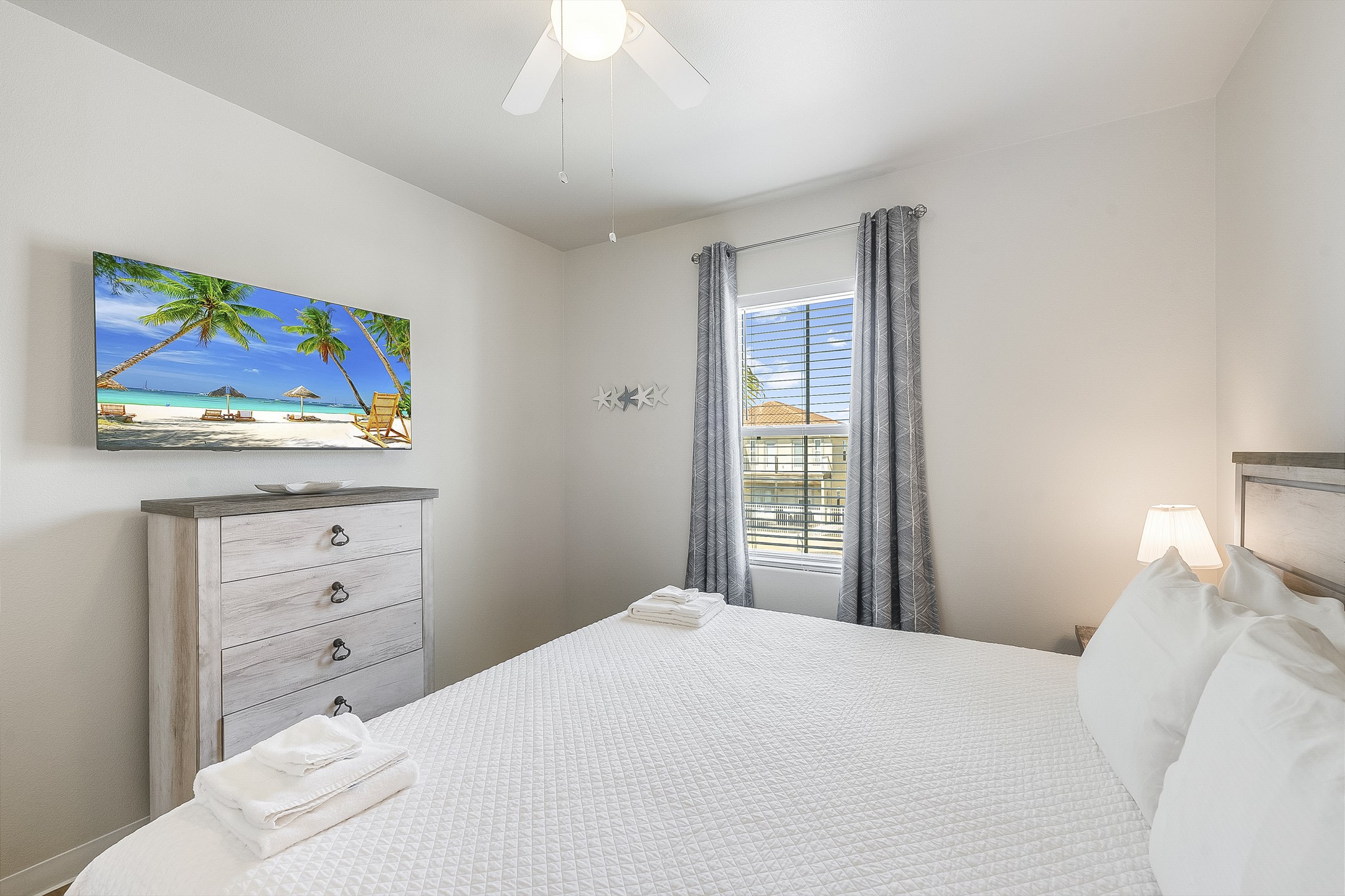 Second bedroom on the second floor with king size bed and flat screen TV