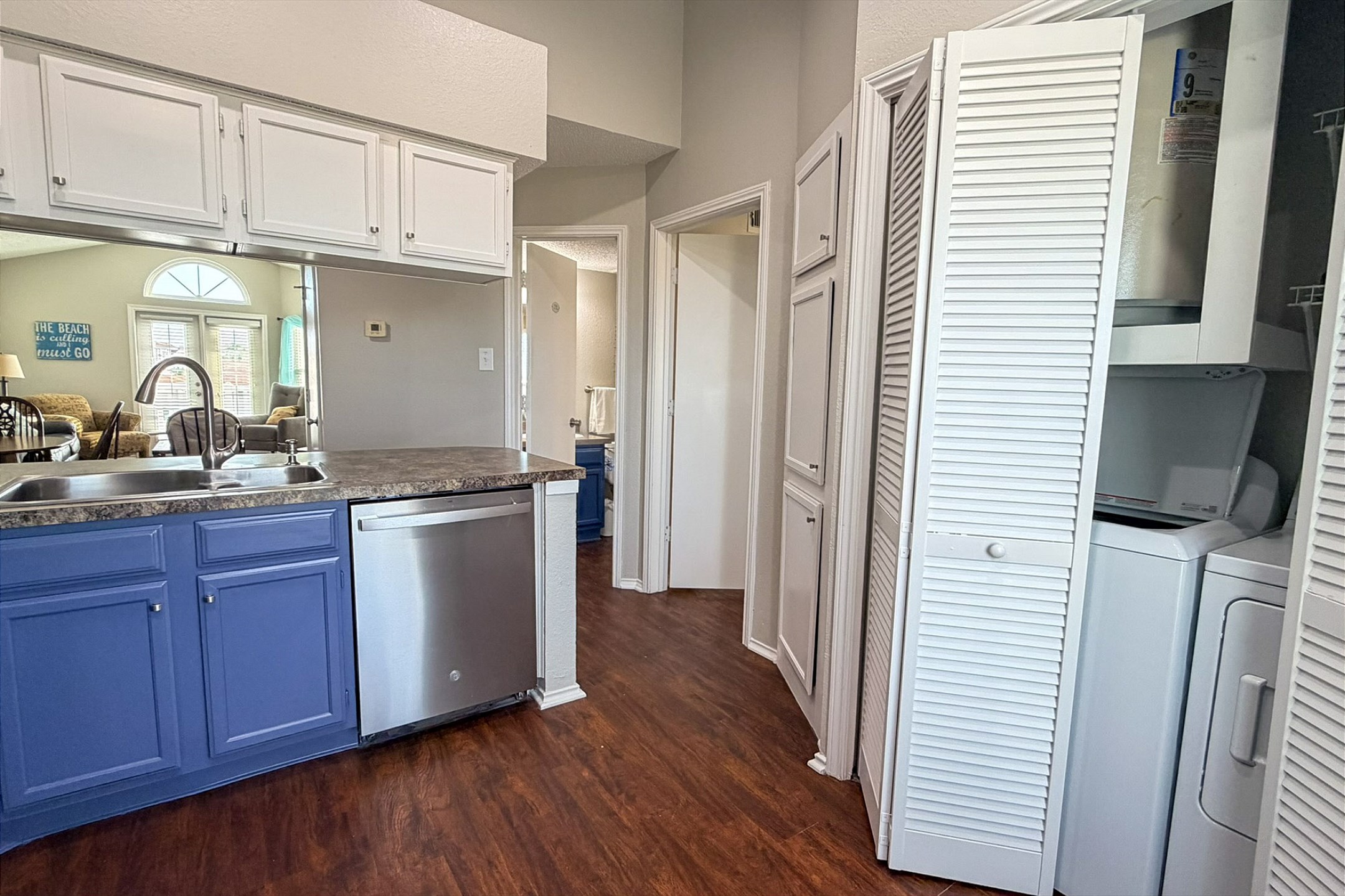 Open kitchen with in property washer and dryer for added convenience 