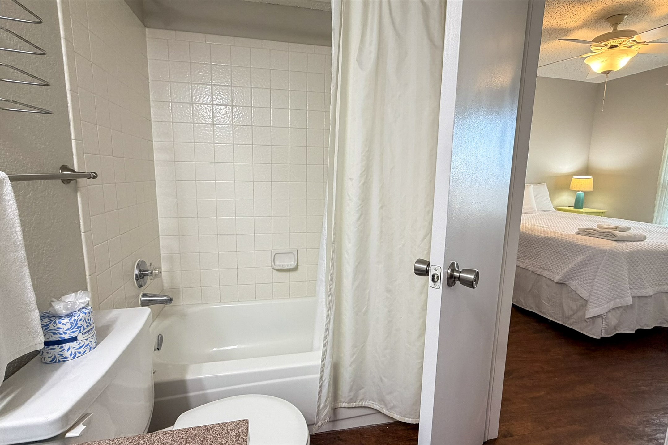 Attached bathroom with tub and shower 