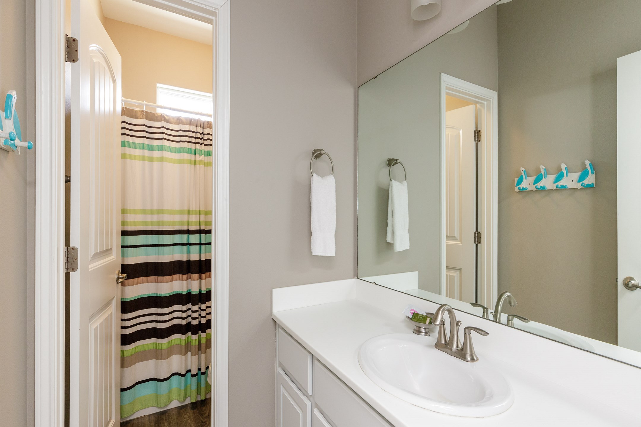Guest bathroom on the second floor with tub and shower combo