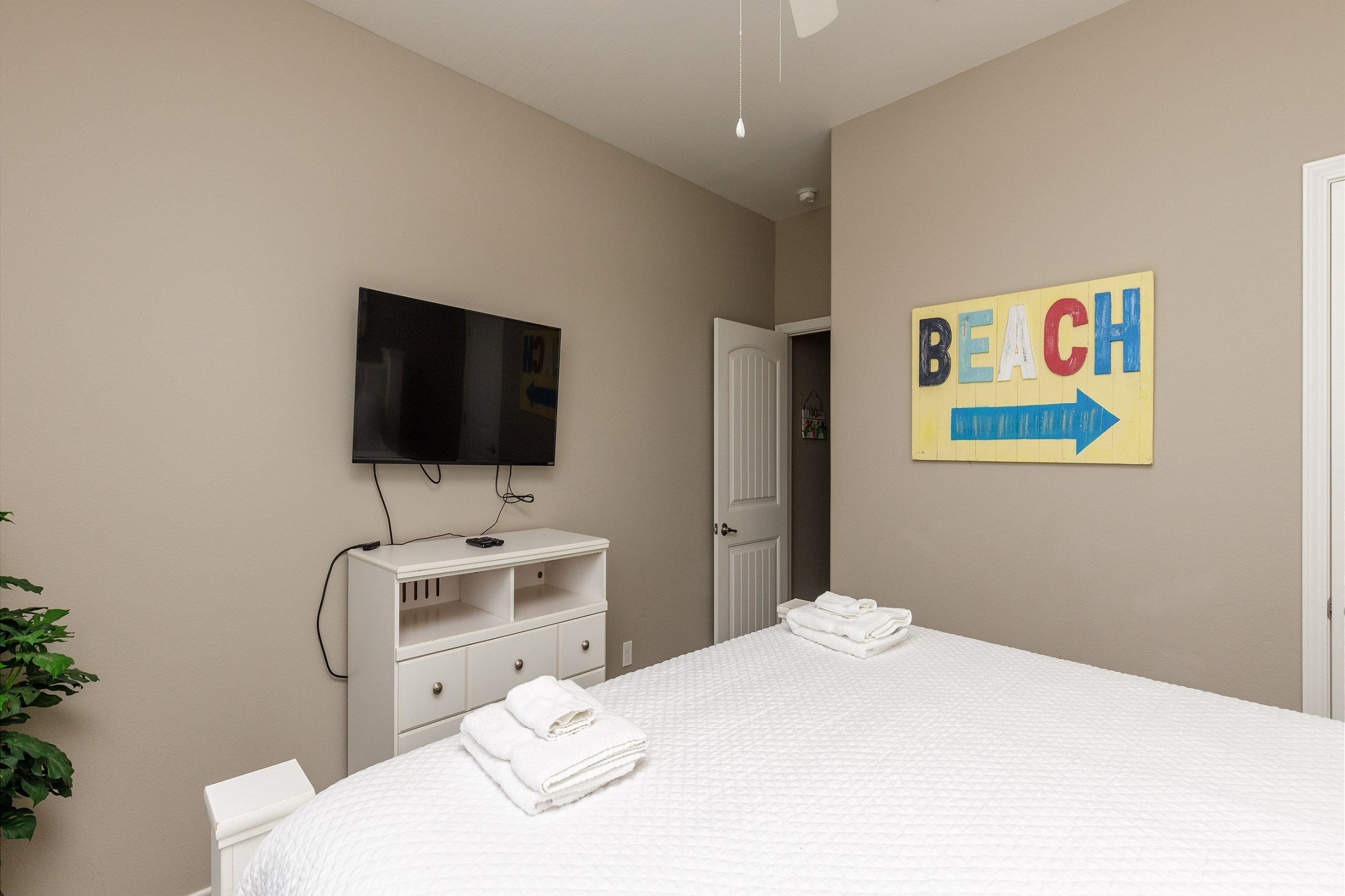 First floor master bedroom with a king size bed