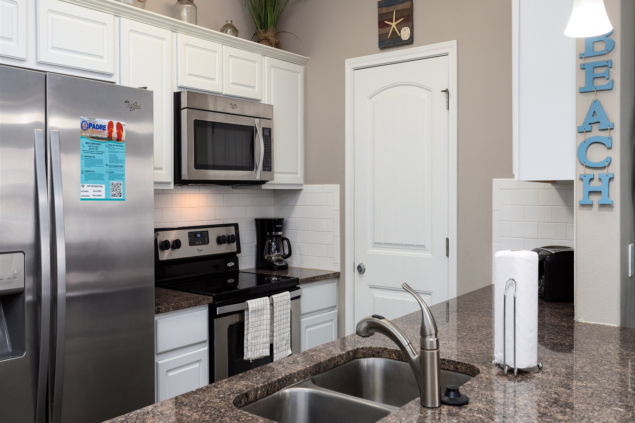 Coffee maker, toaster, cookware, dinnerware, and other kitchen essentials provided