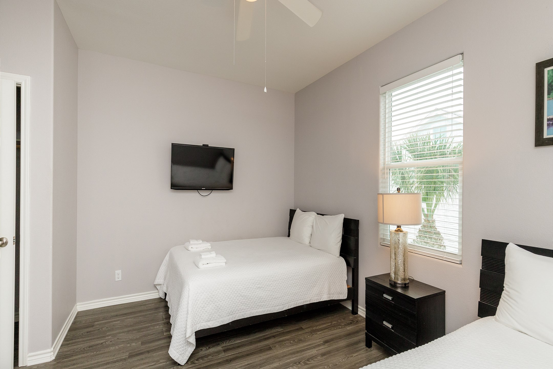 Third bedroom on the second floor with two queen size beds, private bathroom and flat screen TV