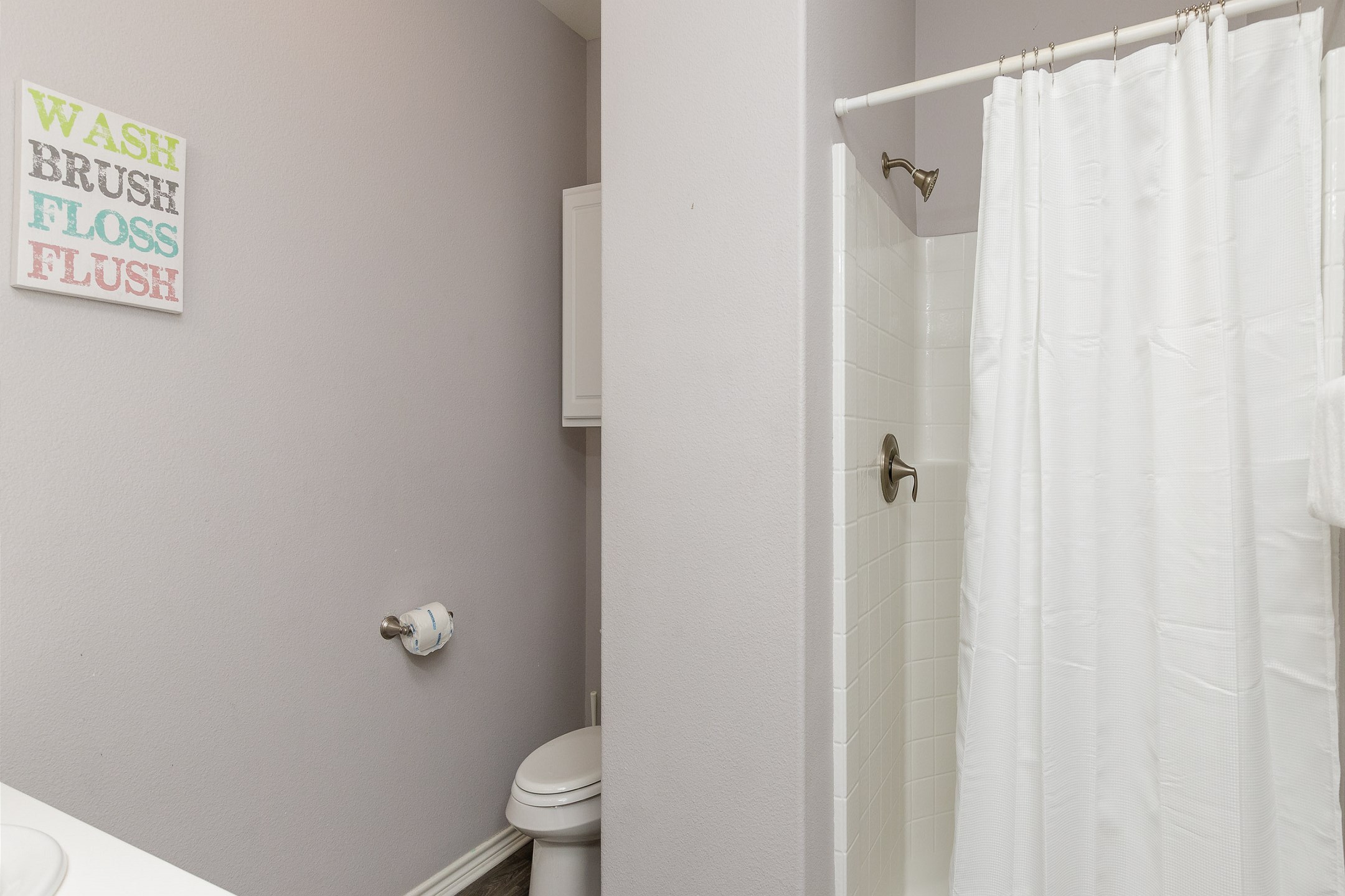 En-suite bathroom off the third bedroom featuring a walk-in shower