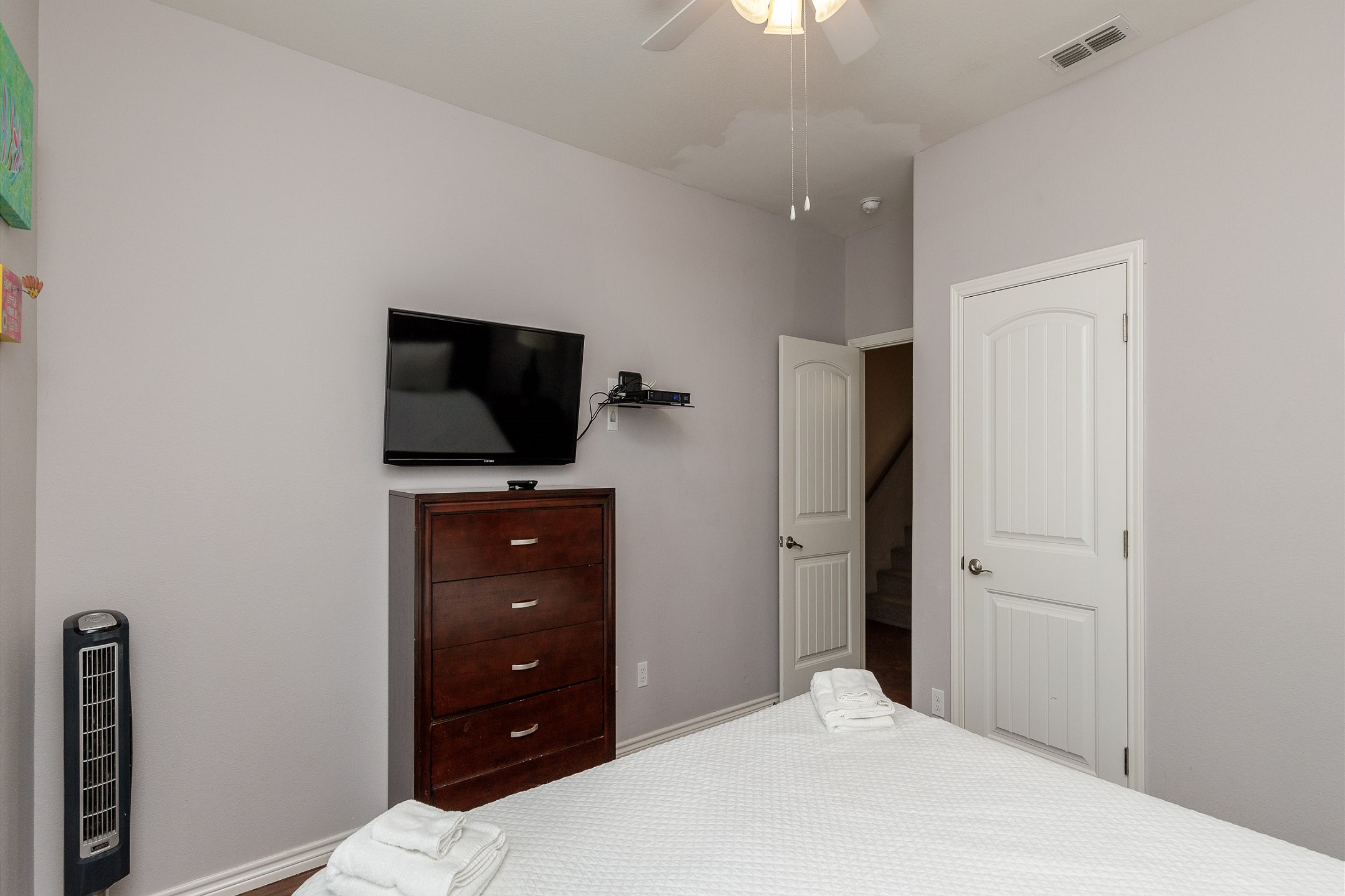 Master bedroom on the first floor with king size bed and flat screen TV