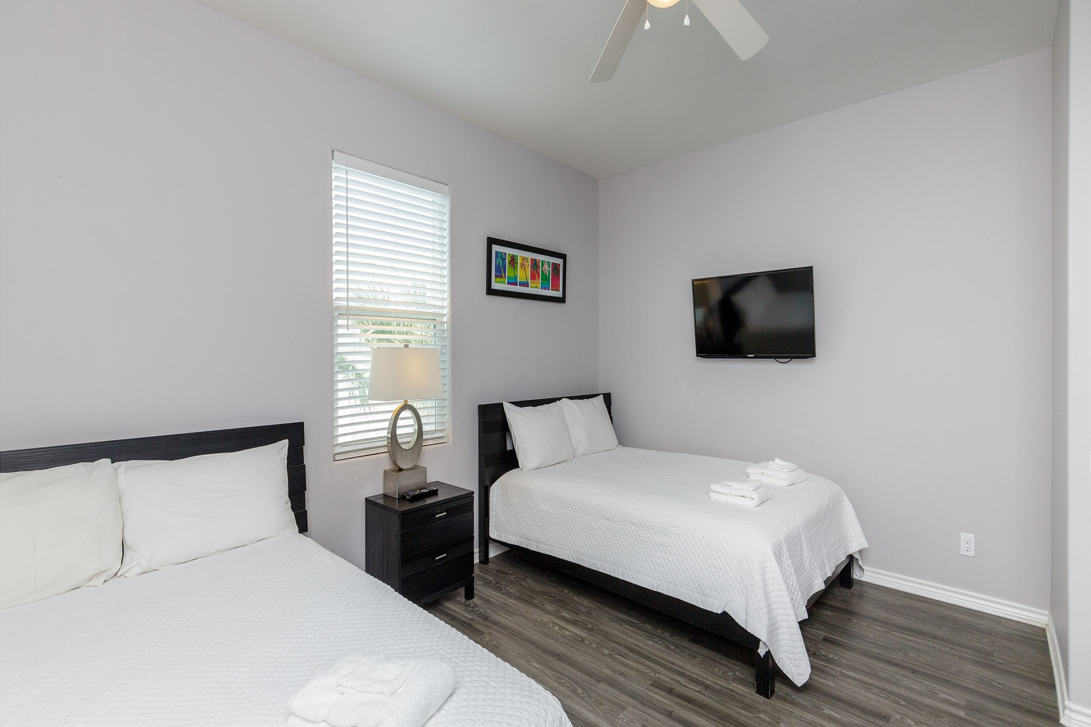 Third bedroom on the second floor with two queen size beds, private bathroom and flat screen TV