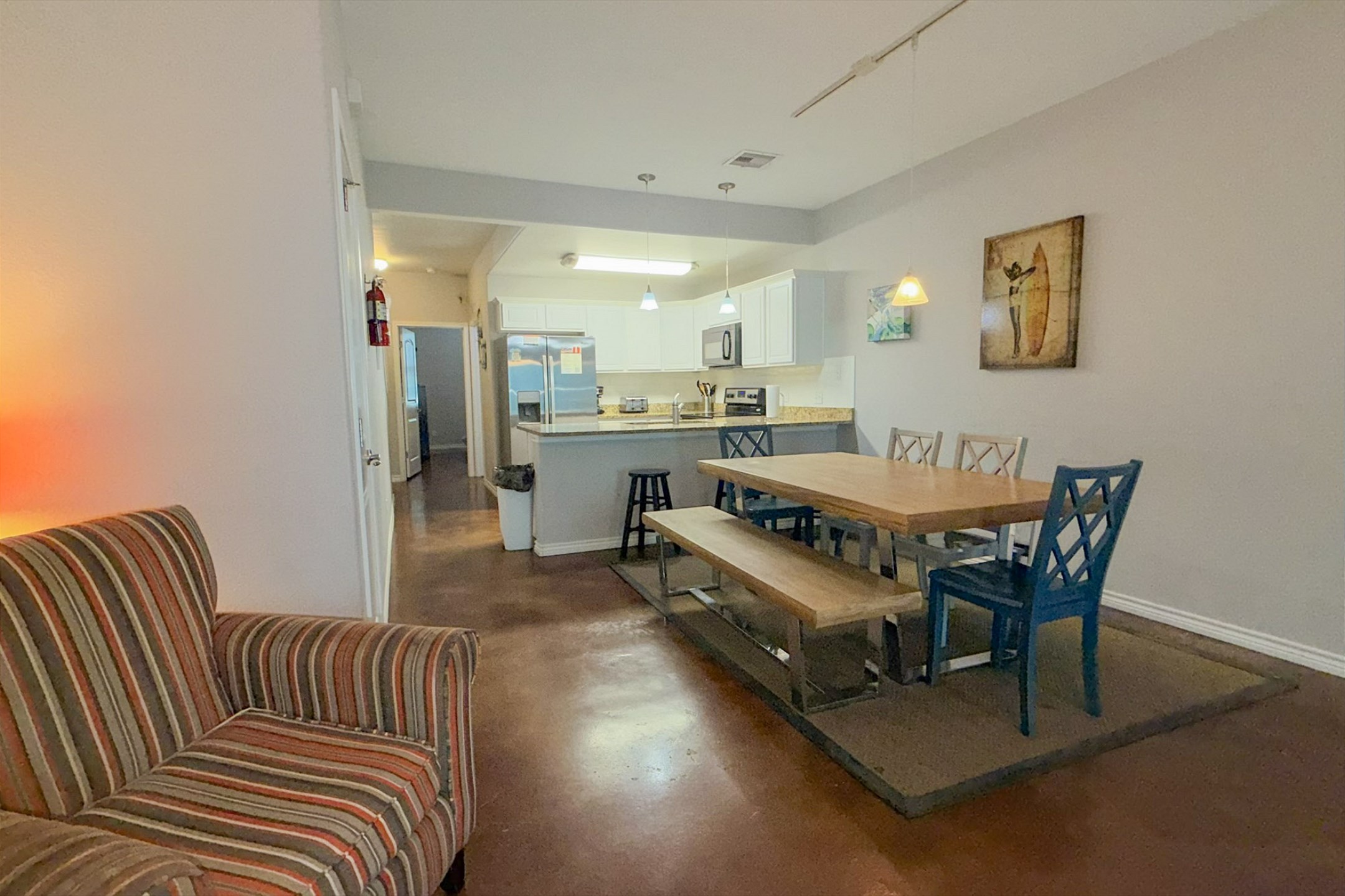 The kitchen, dining, and living areas blend together seamlessly for a bright and airy feel