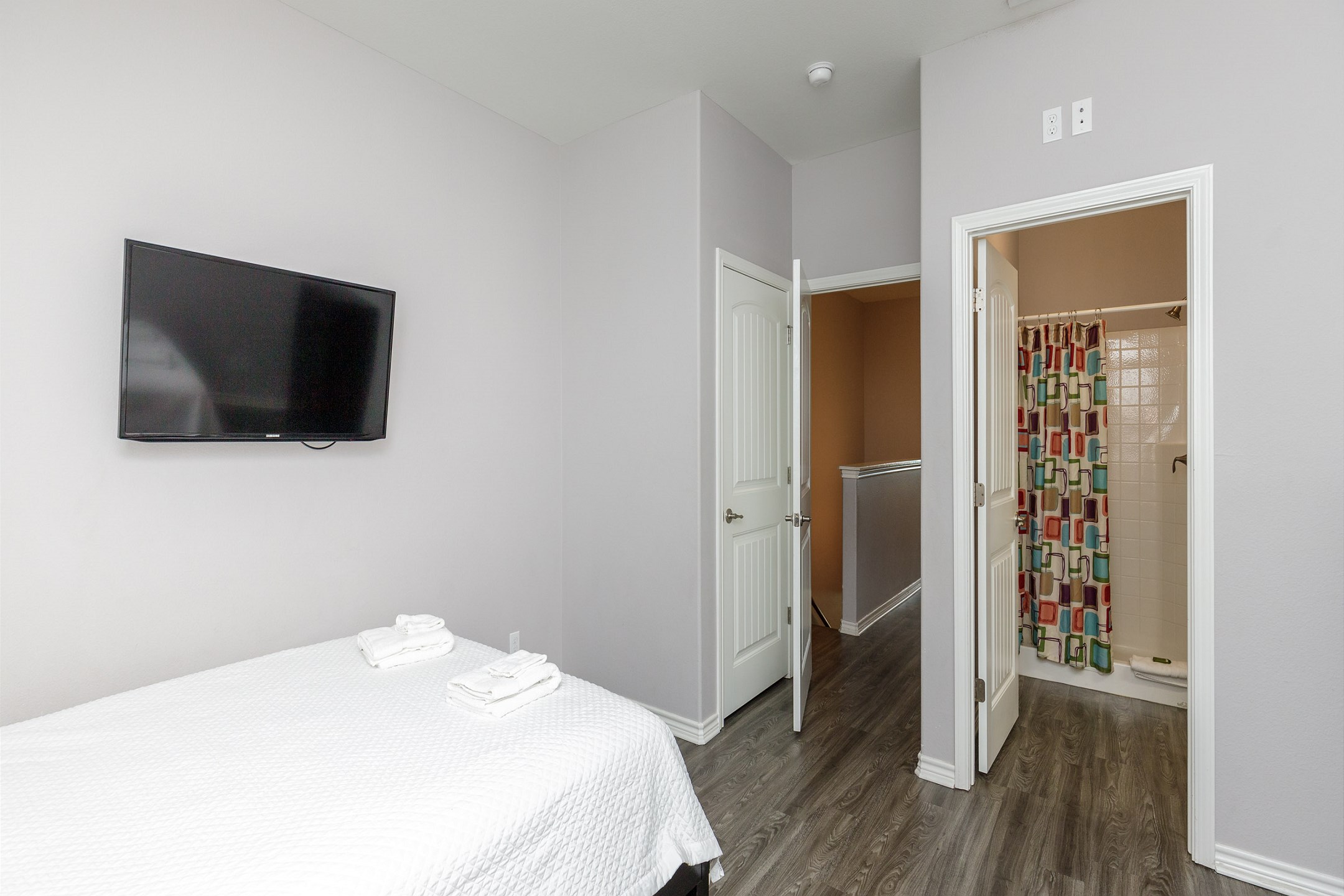 Third bedroom on the second floor with two queen size beds, private bathroom and flat screen TV