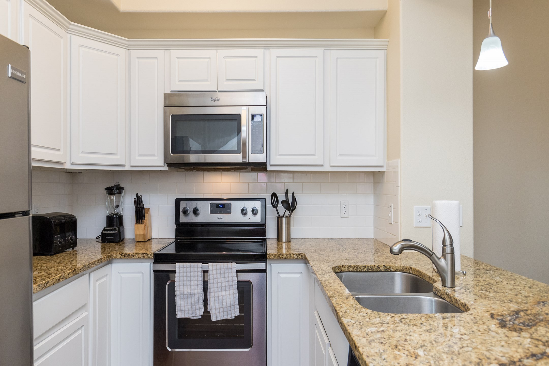 Fully equipped kitchen with stainless steel appliances 