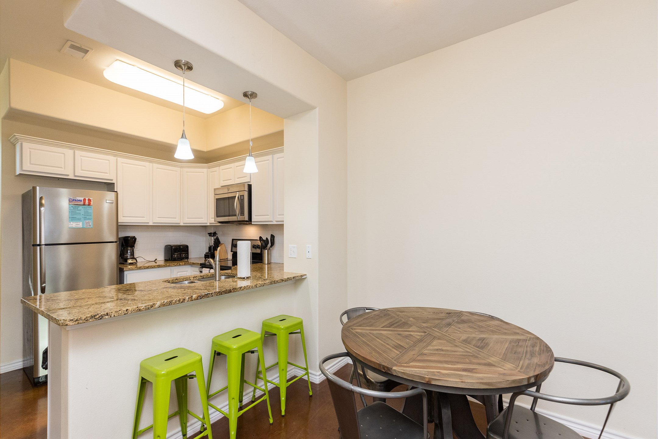 Dining area with easy access to fully equipped kitchen 