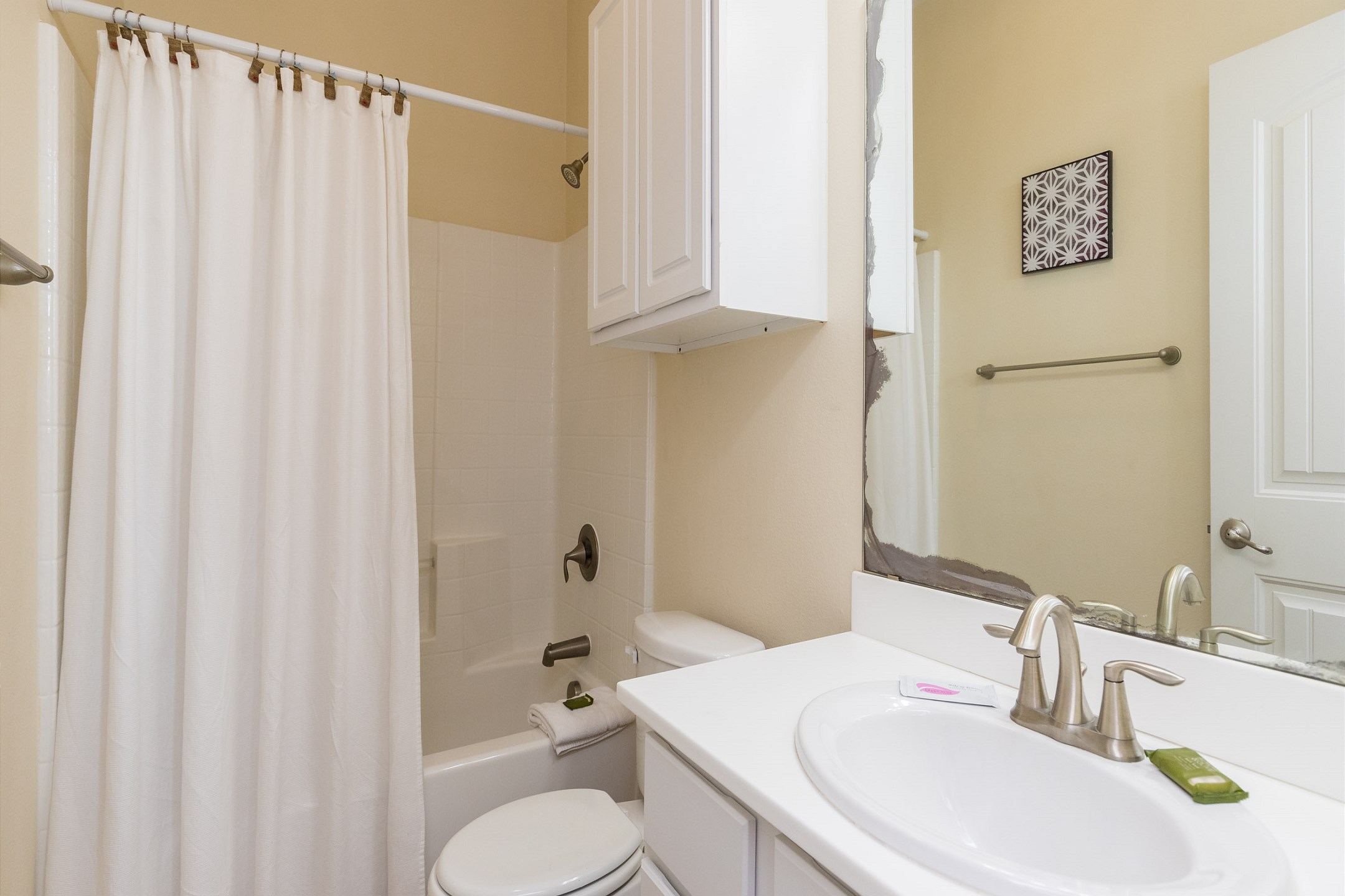 Guest bathroom on the second floor with tub and shower