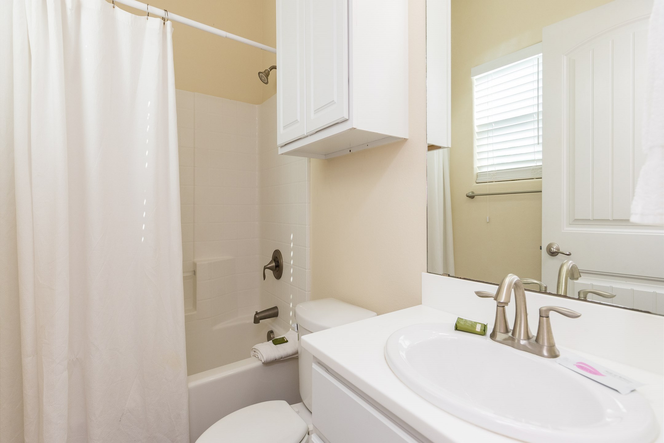 Guest bathroom on the first floor with tub and shower 