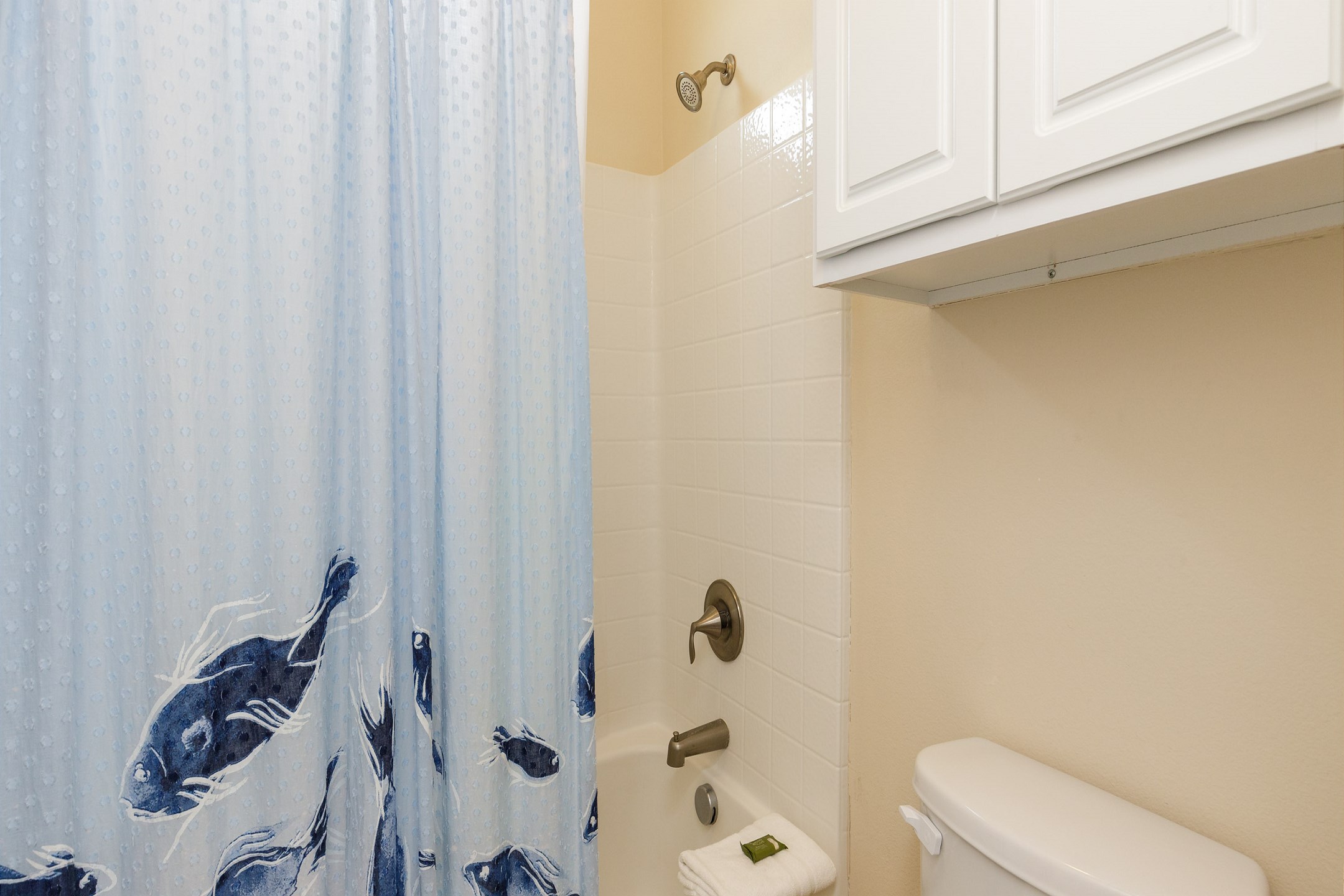 Guest bathroom on the second floor with tub and shower combo
