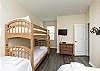 Third bedroom on the second floor with full size bed, twin bed and twin size bunk beds along with flat screen TV