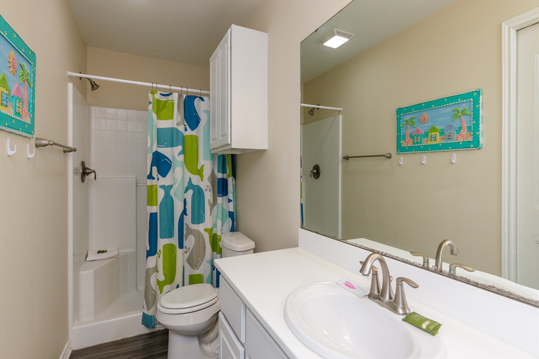 Bathroom on the first floor with walk in shower that shares access from master bedroom and hallway