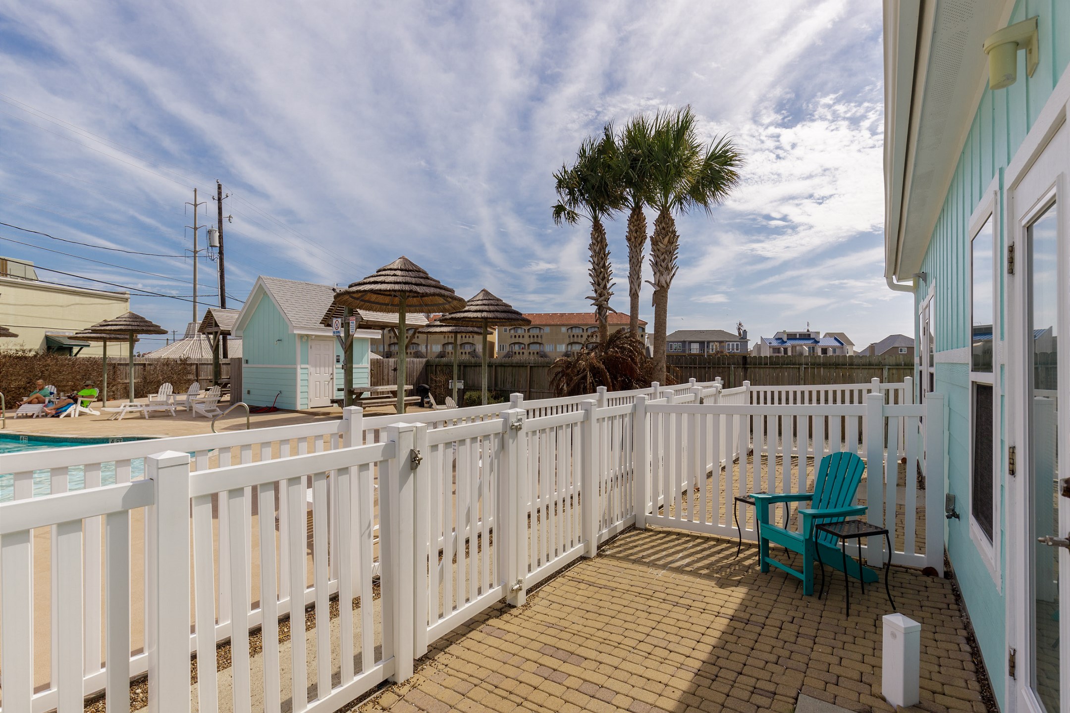 Personal patio off the living and dining area has easy access to the pool as well as a nice view